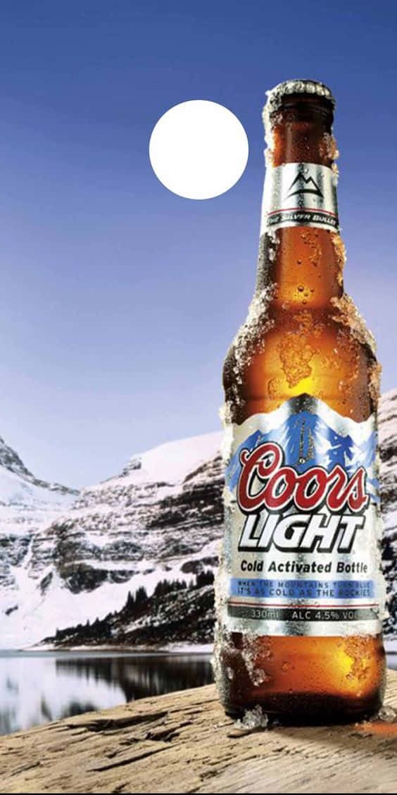 Coors Light Bottle On A Rock Background