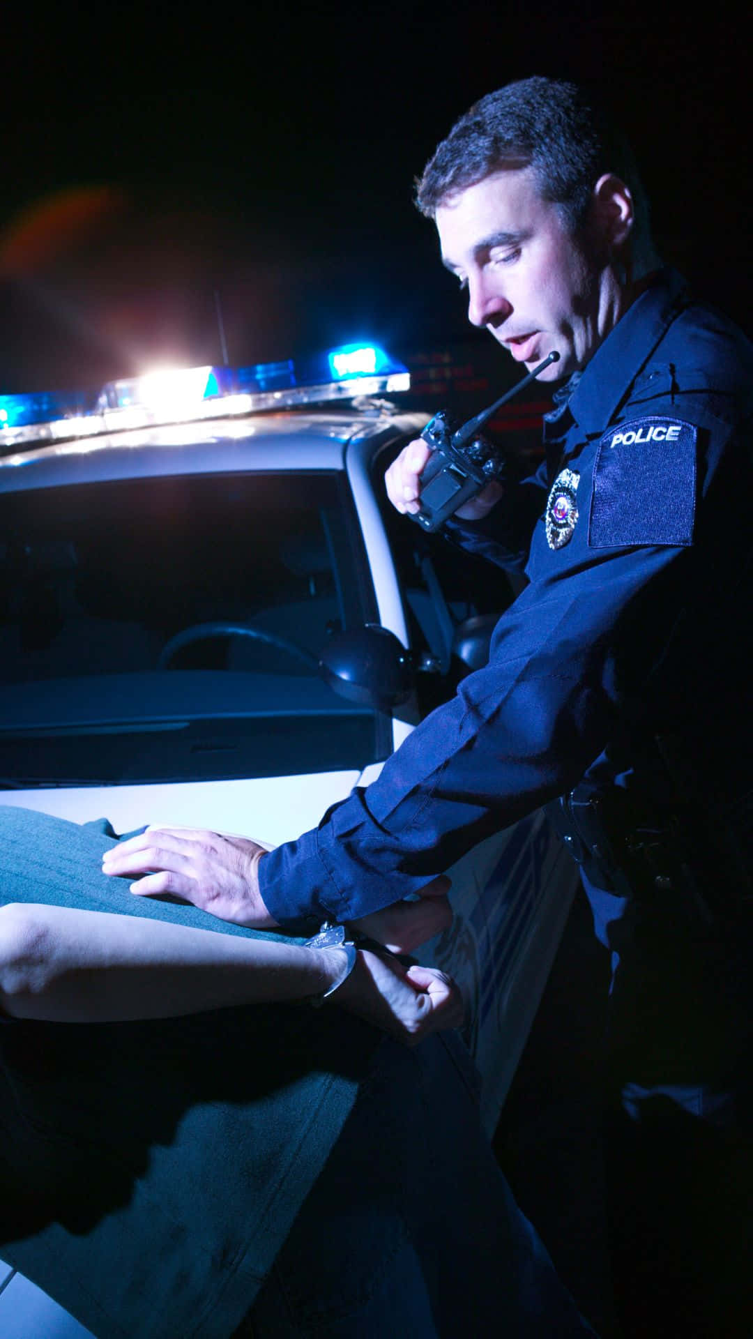 Cop Arresting A Man During Dui Checkpoint Background