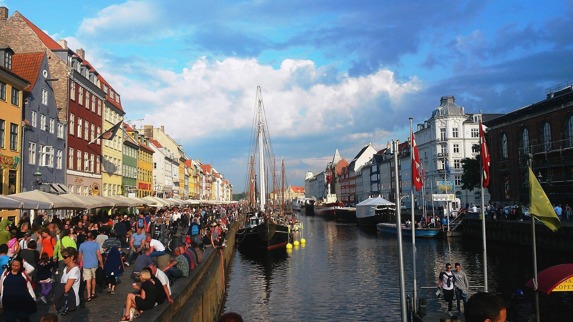 Copenhagen Crowd Near The River Background