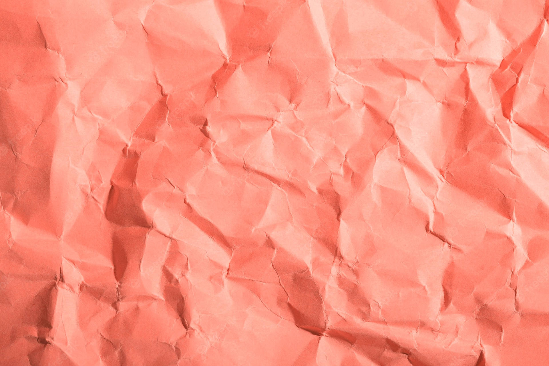 Coral Pink Crumpled Paper Background