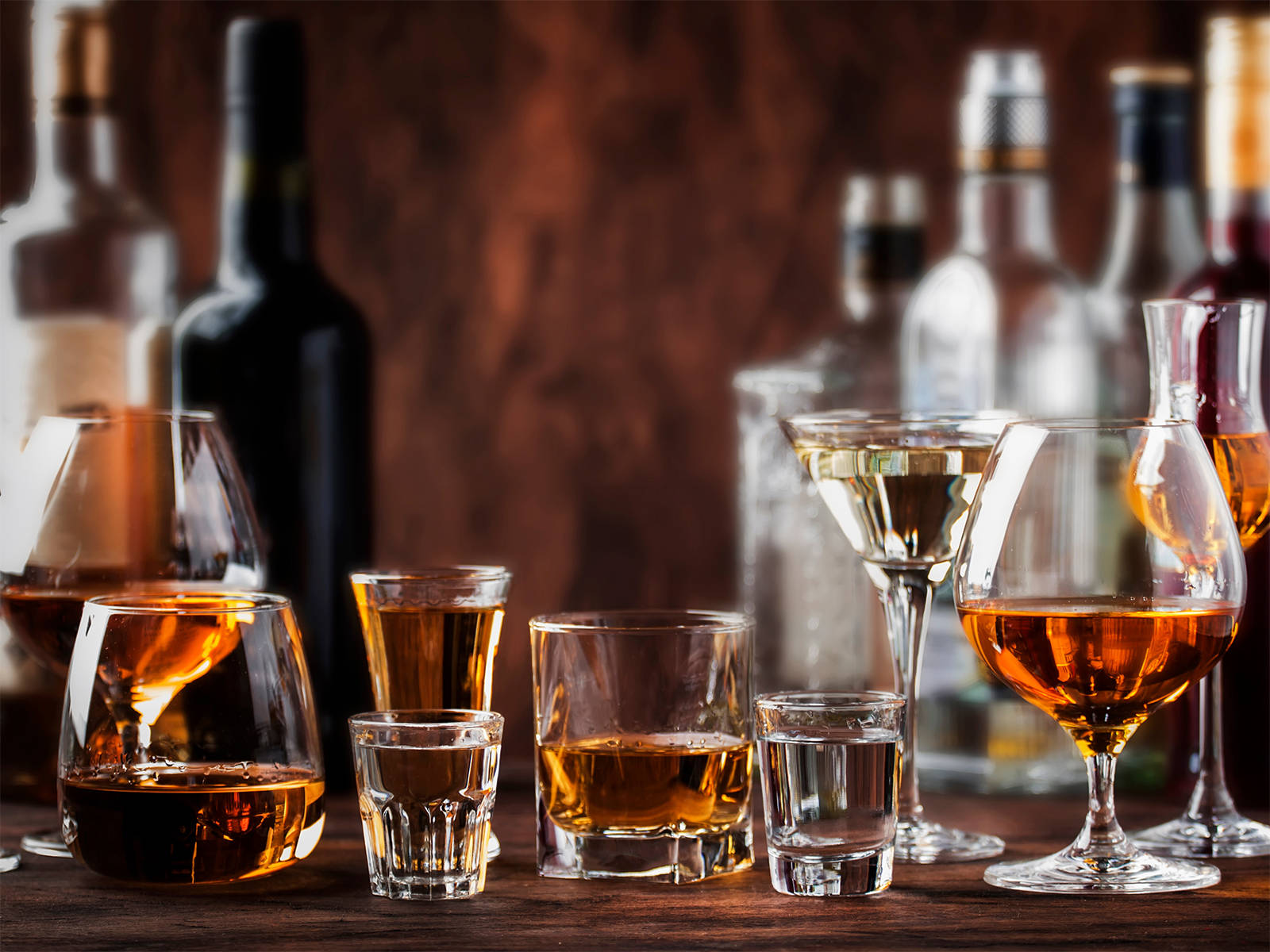 Cordial Drinks Displayed Elegantly On The Bar Background