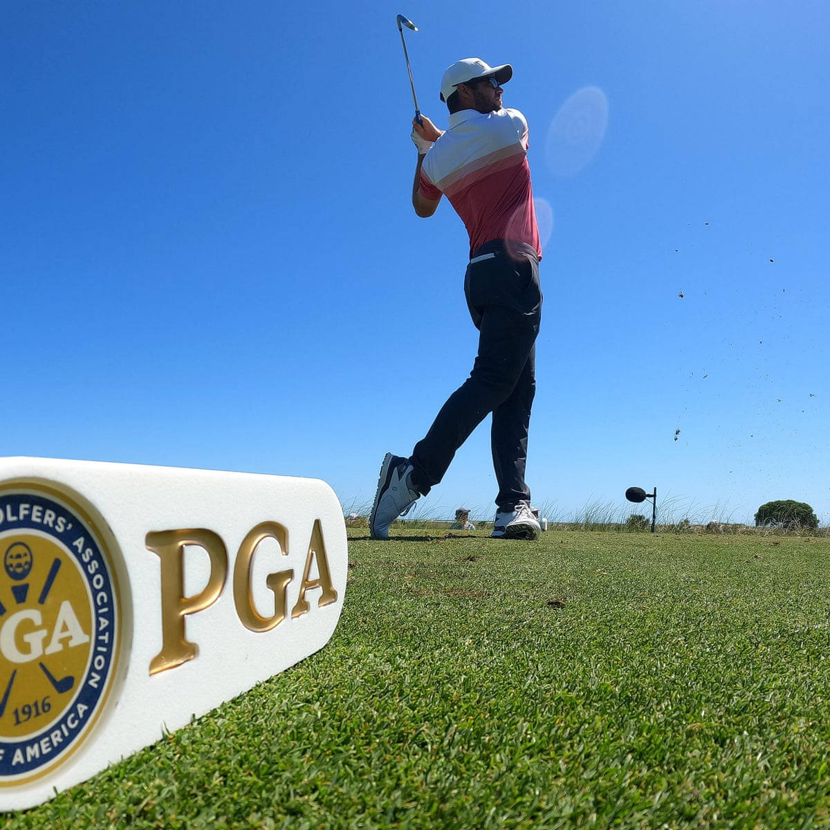 Corey Conners Showing Off His Excellent Golf Swing At A Tournament. Background