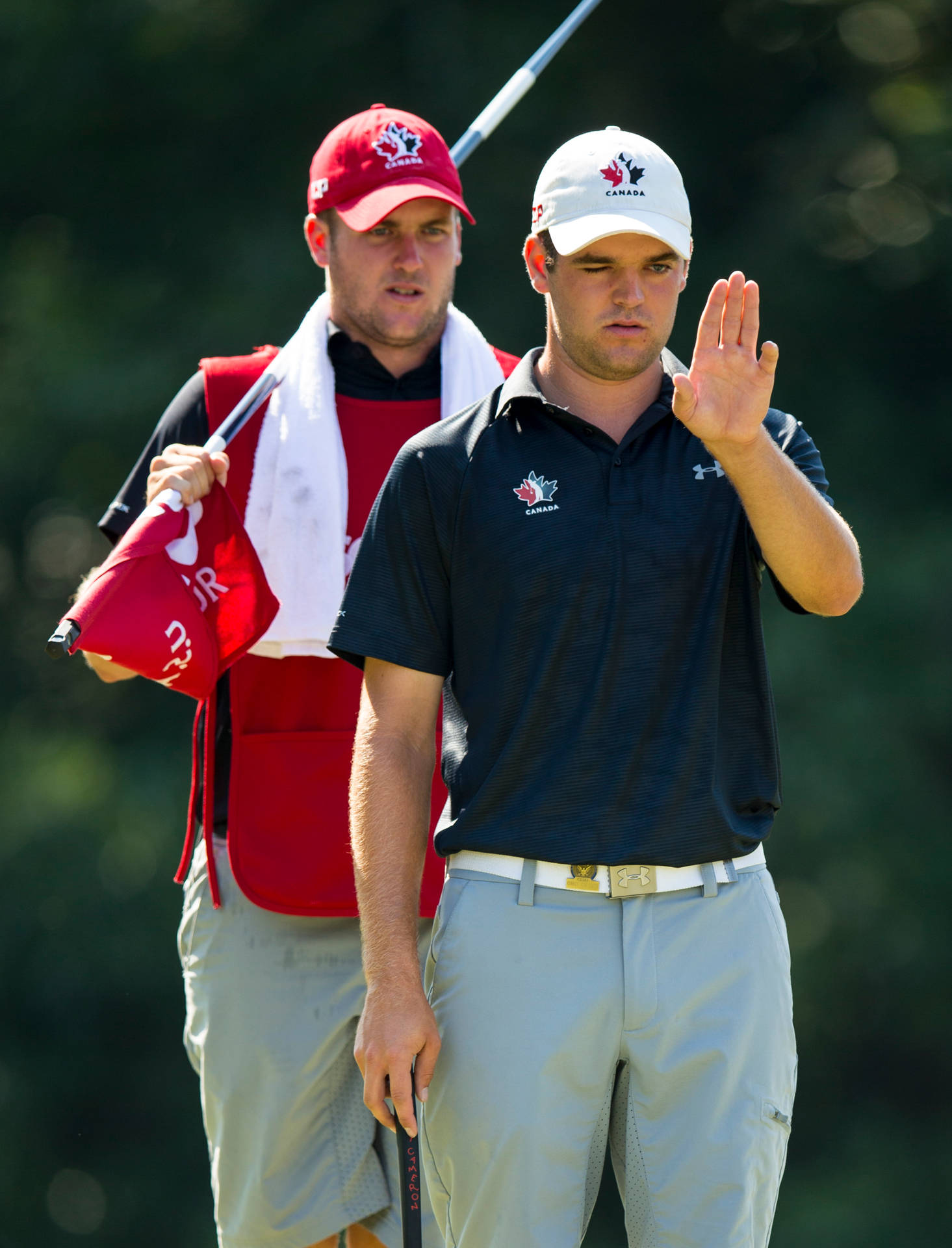 Corey Conners With His Caddie Background