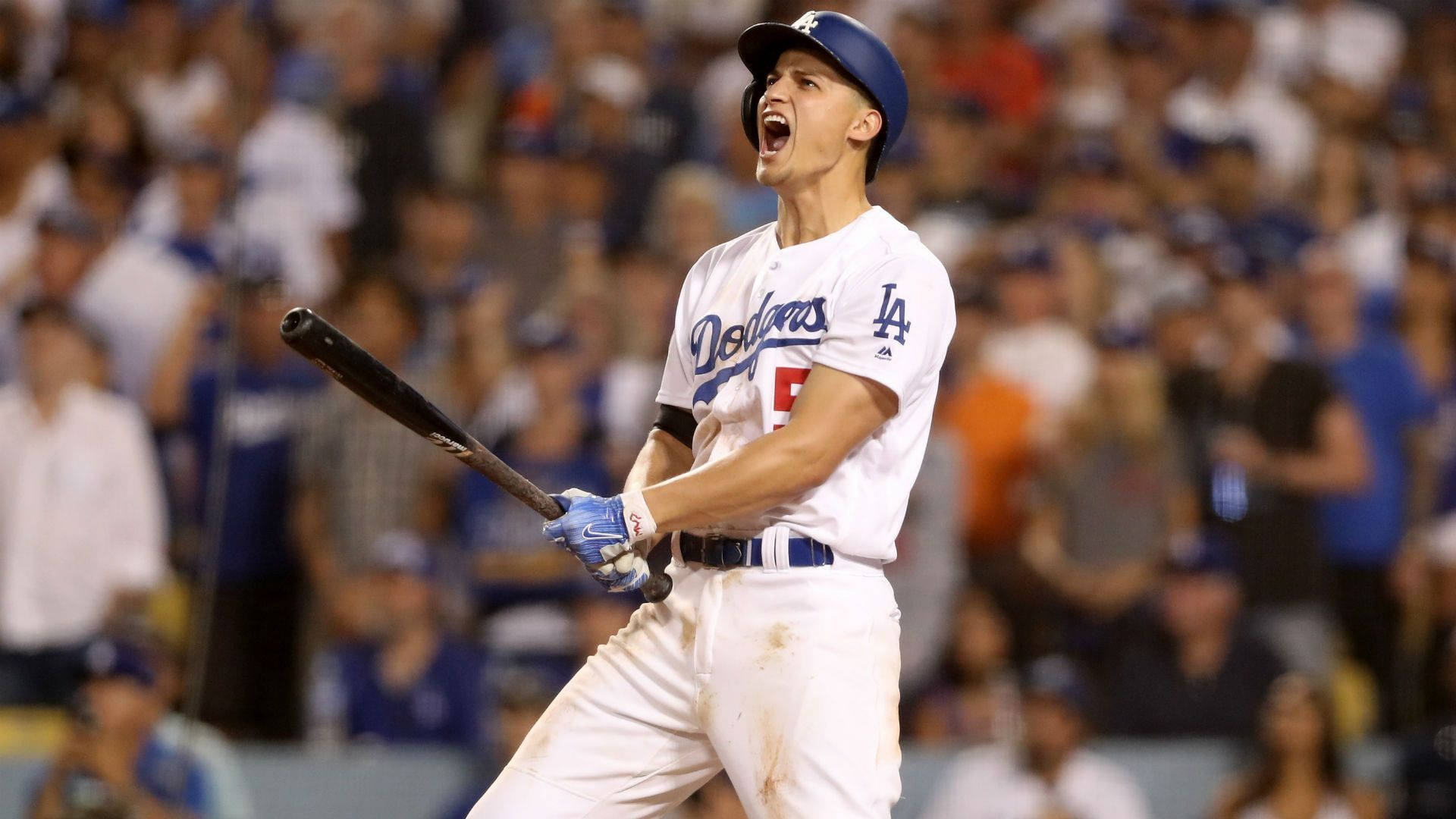 Corey Seager Cheering While Holding A Bat Background
