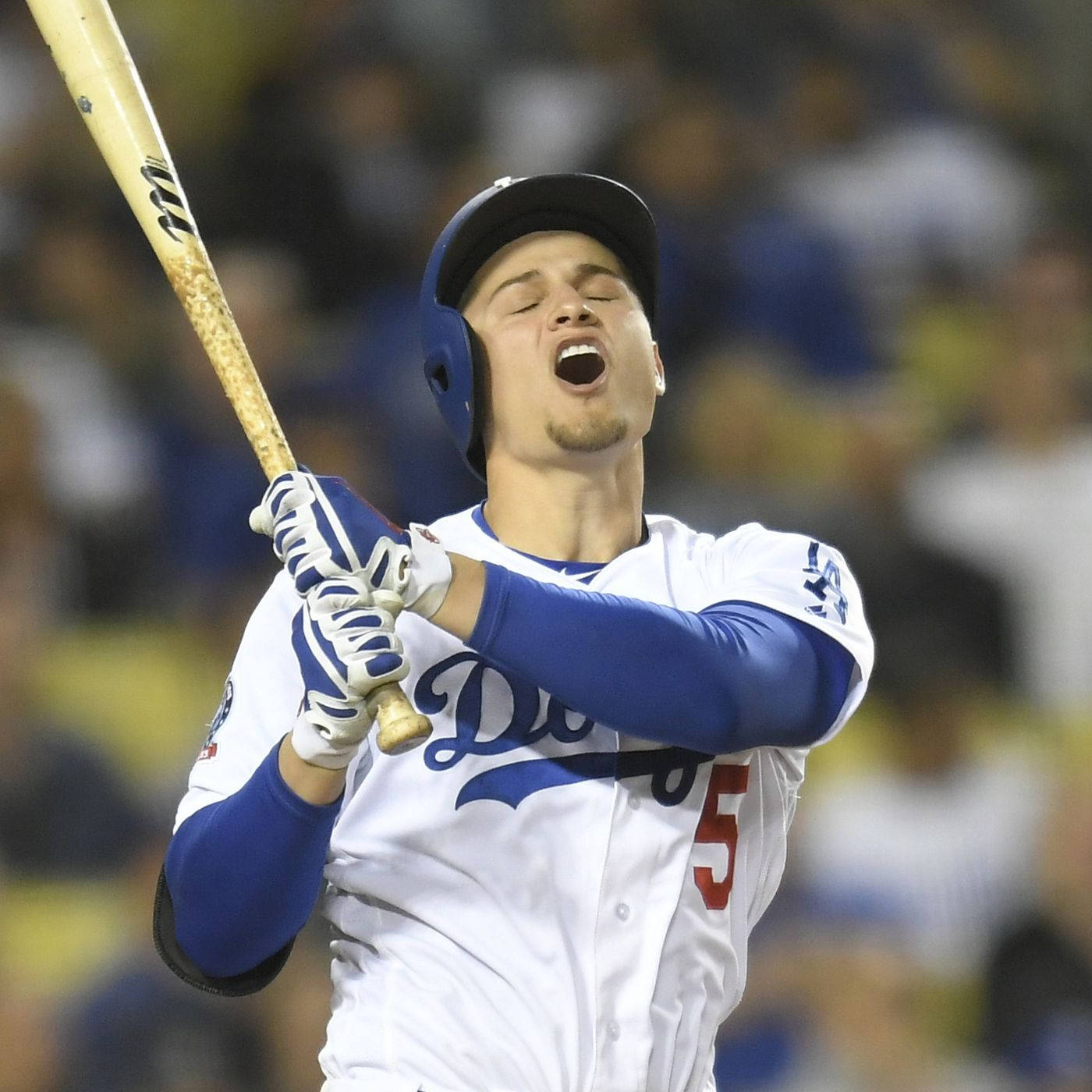 Corey Seager Holding Bat Open Mouth And Eyes Closed Background