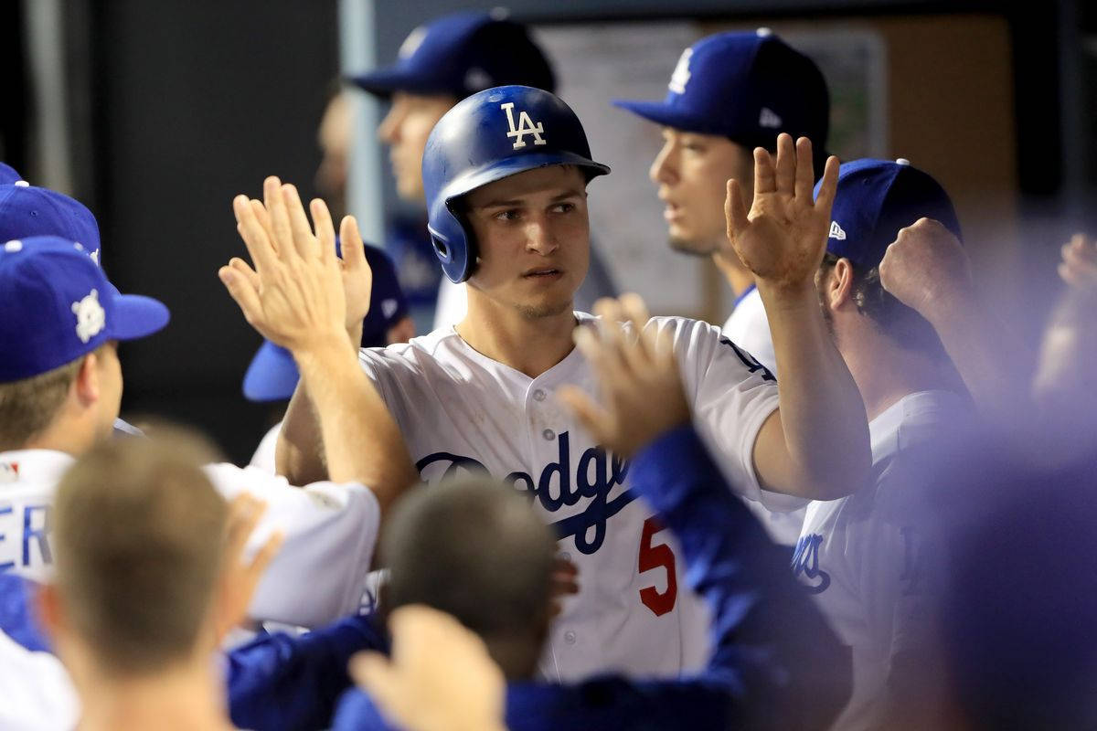Corey Seager Holding Hands Up For High Fives Background