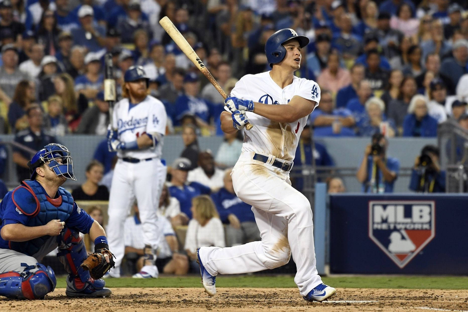 Corey Seager Looking Up While Holding Bat Background