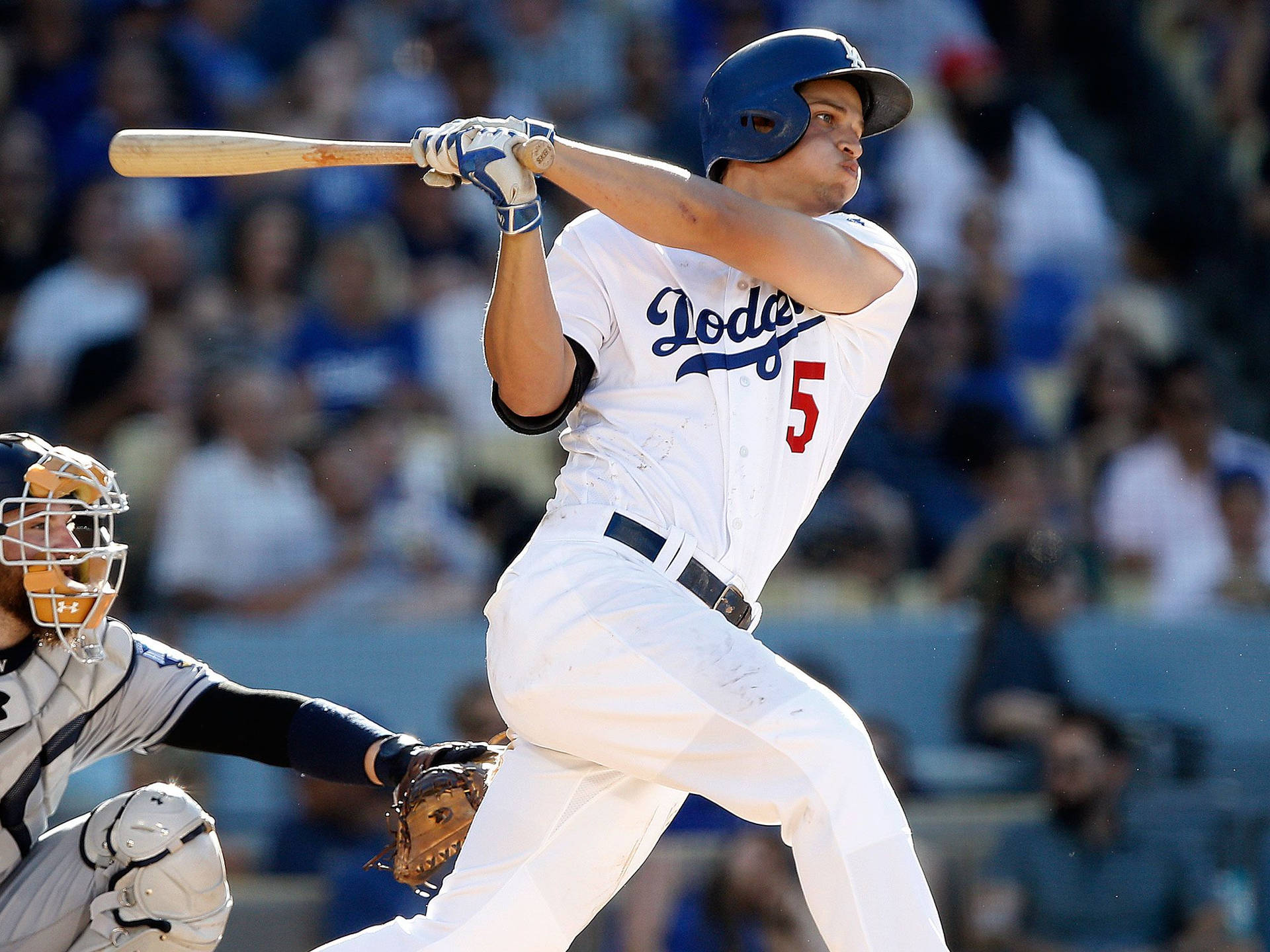 Corey Seager Swinging His Bat With Puffed Cheeks Background