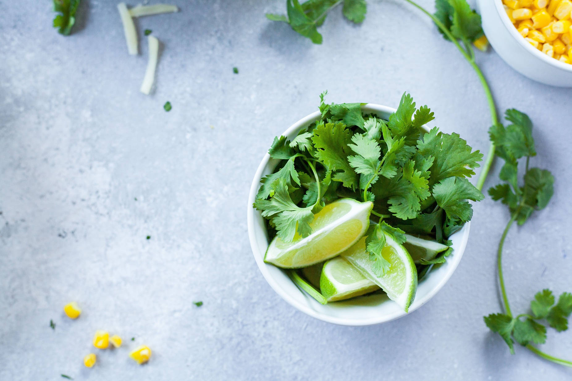 Coriander Herbs And Sliced Limes Overhead Shot Background