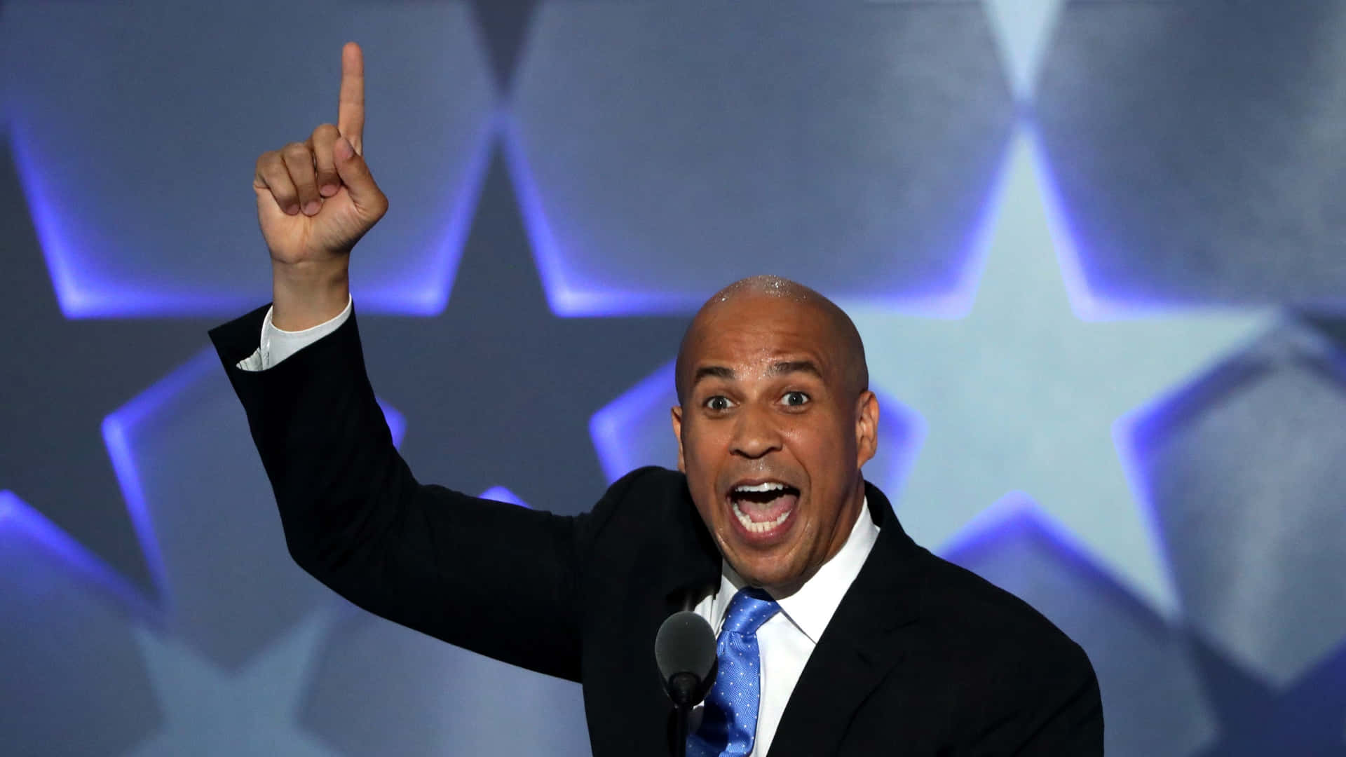 Cory Booker Energetically Pointing Upwards Background