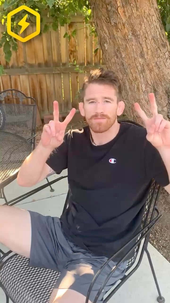Cory Sandhagen Flashing A Double Peace Sign Background