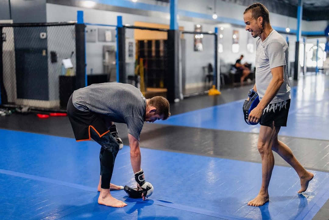 Cory Sandhagen Picking Boxing Mitt Background