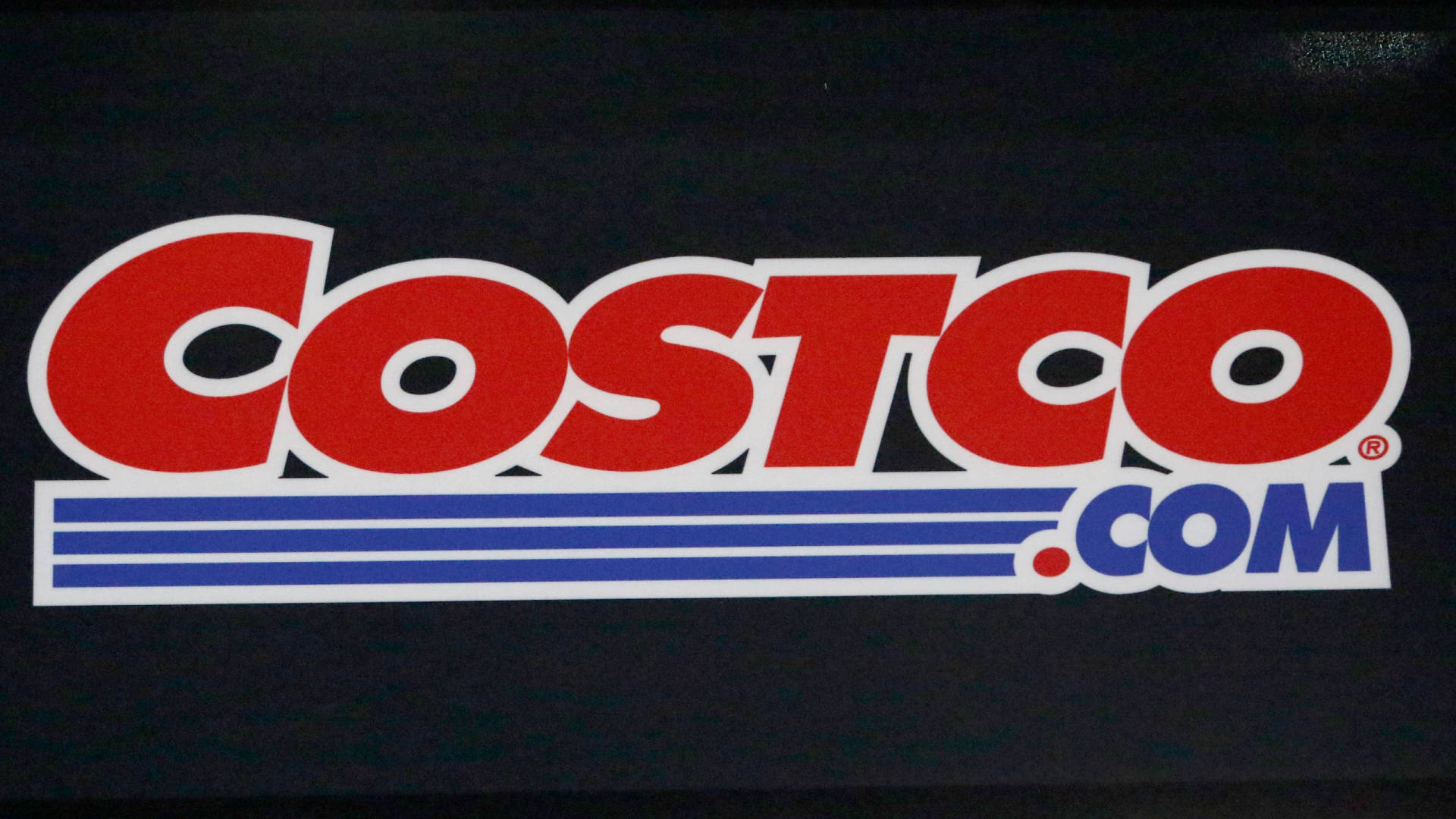 Costco Logo Over Black Backdrop Background