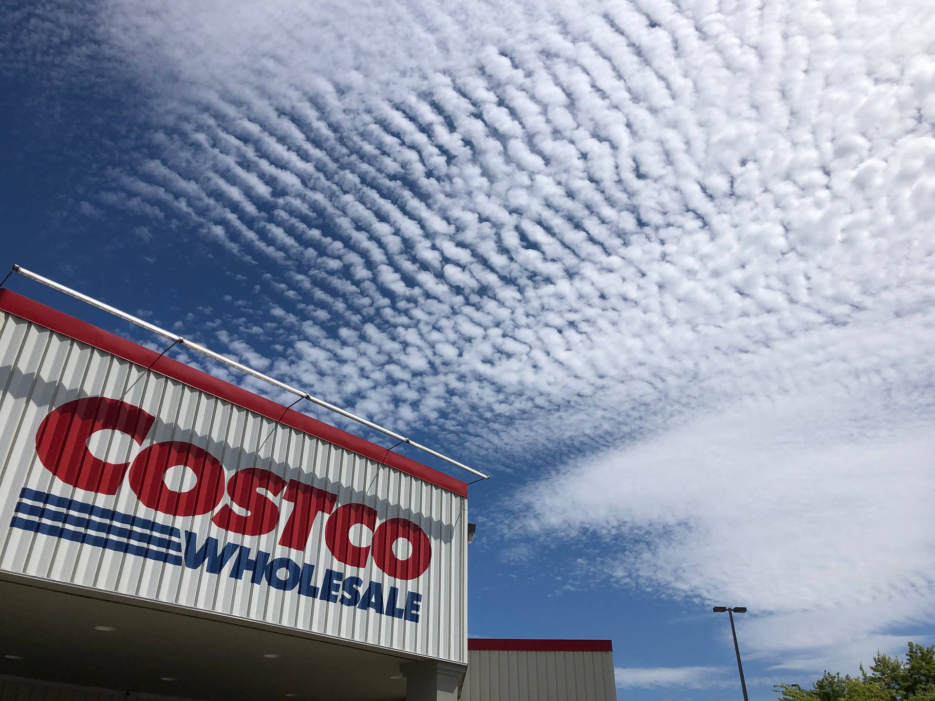 Costco Wholesale White Blue Clouds Background