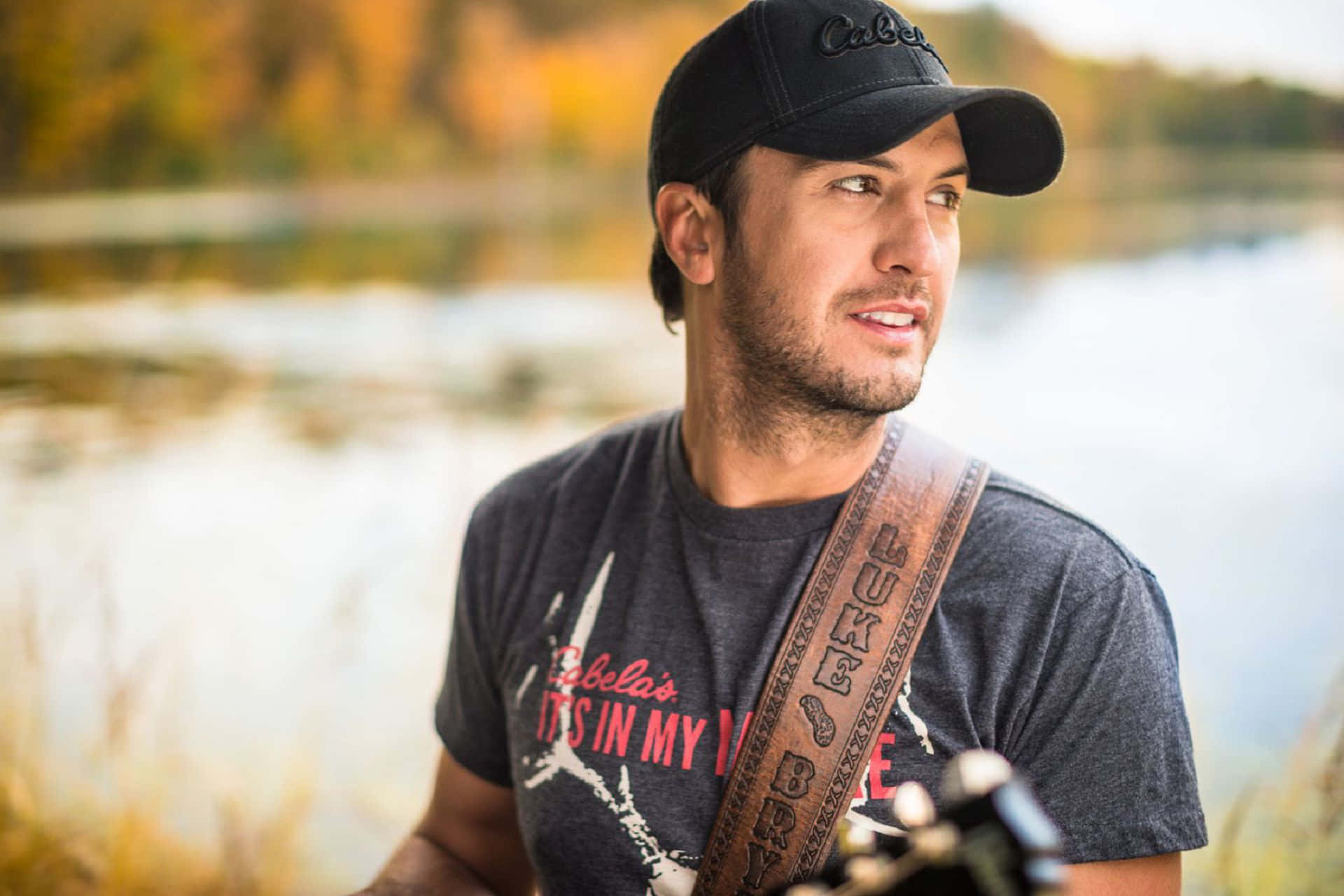 Country Music Superstar Luke Bryan Strums His Guitar Onstage Background