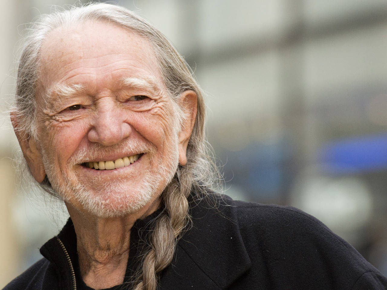 Country Musician Willie Nelson Smiling Background