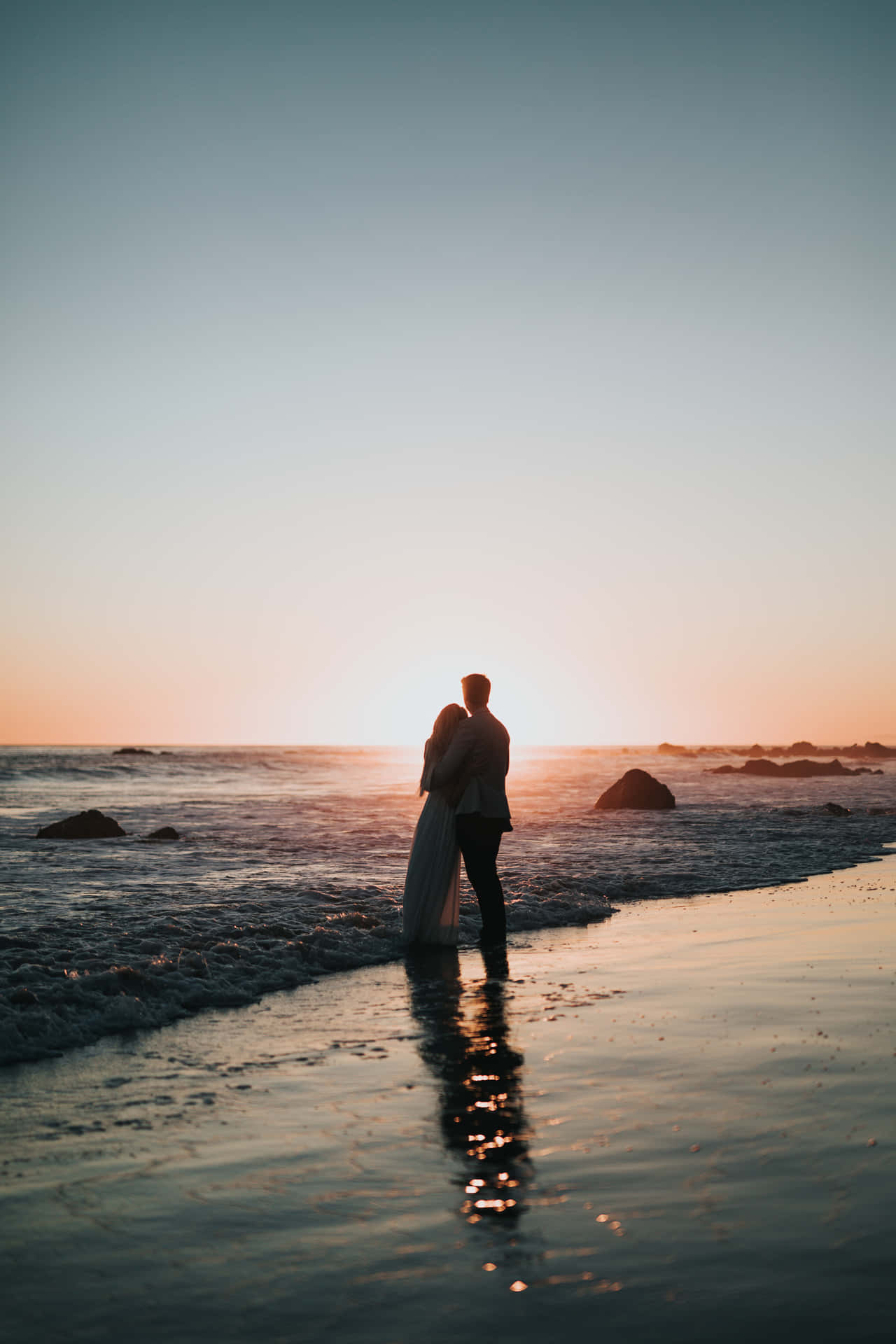 Couple At Beach During Sunset Background