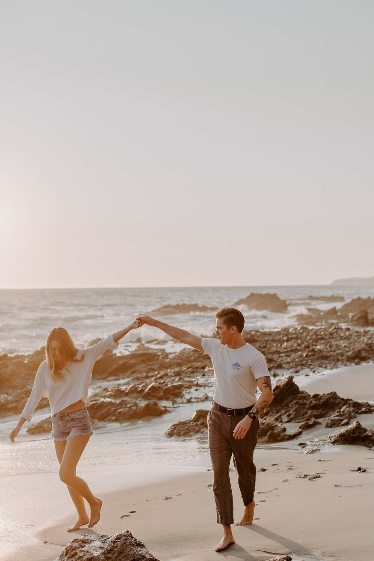 Couple At Beach In Laguna California Holding Hands Background