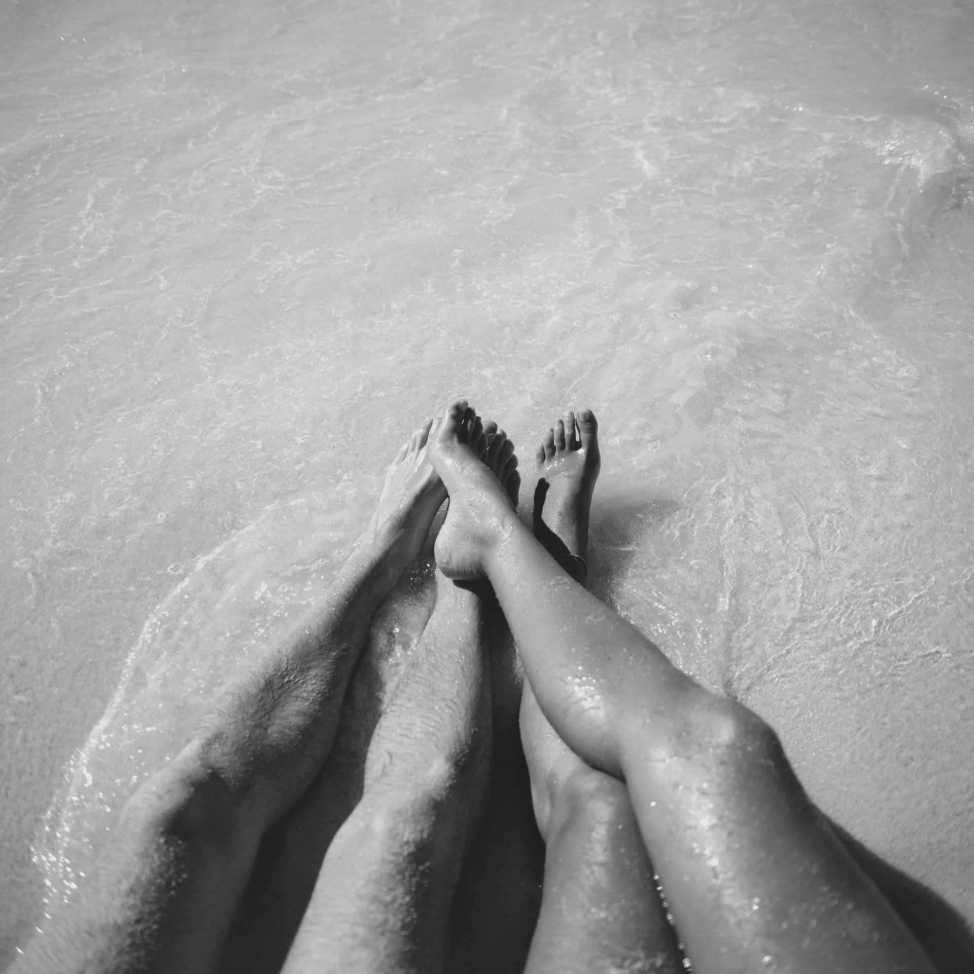 Couple At Beach Leg Black And White Photograph Background