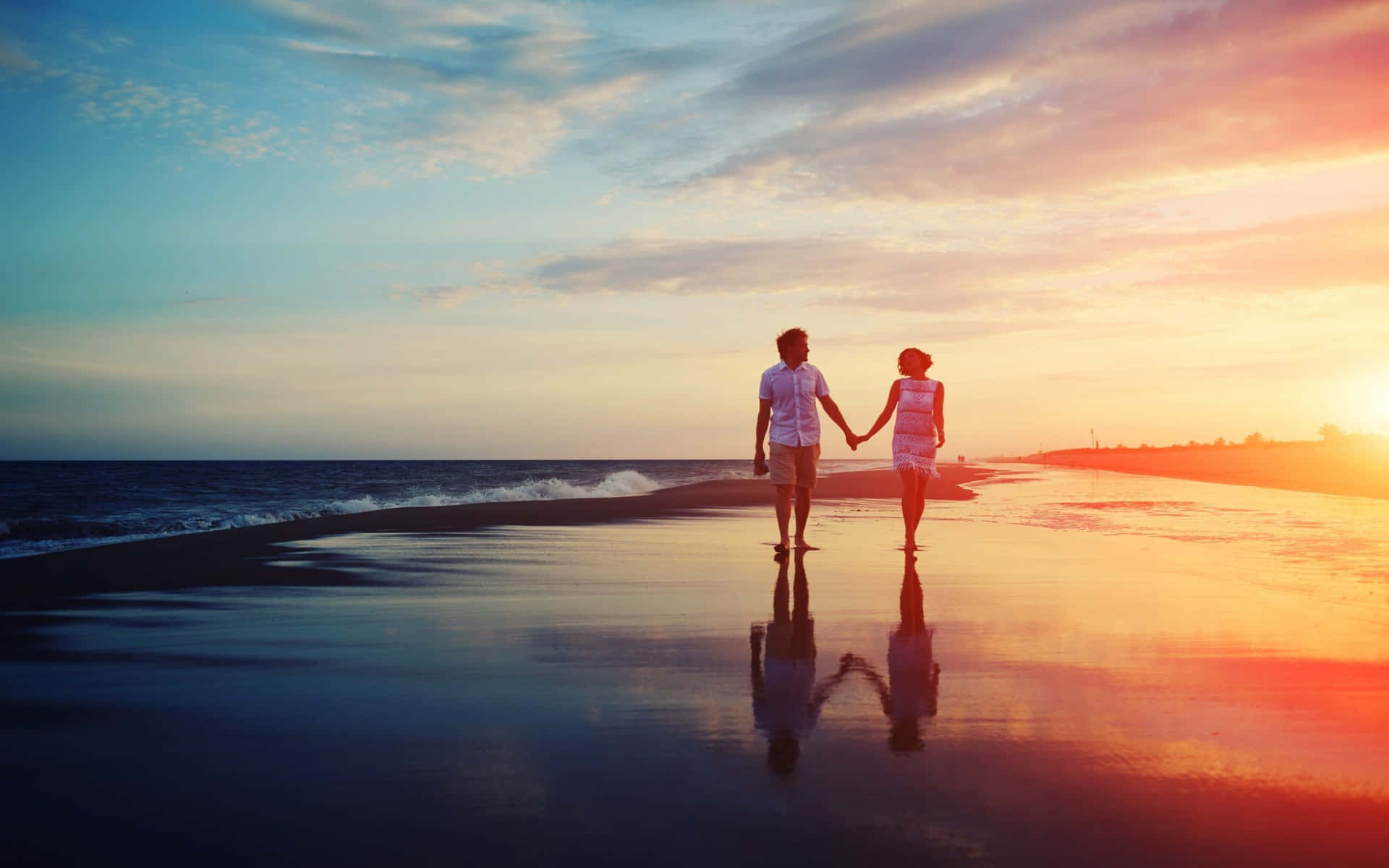 Couple At Beach On Wet Section Sunset Shot Background