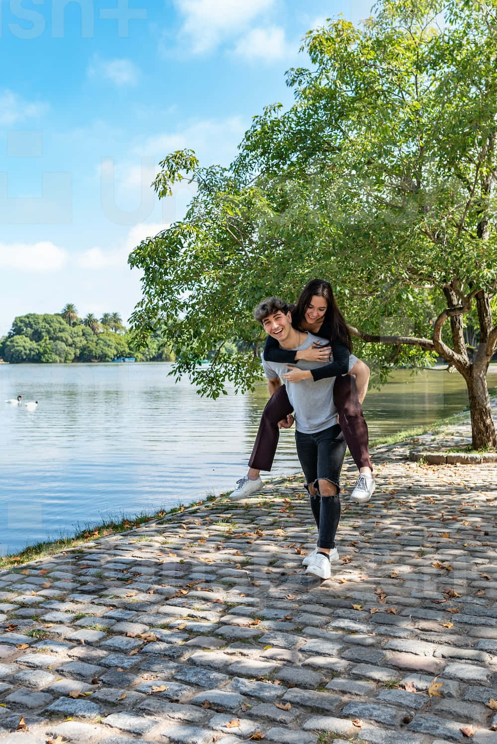 Couple At Beach Piggyback Ride Background