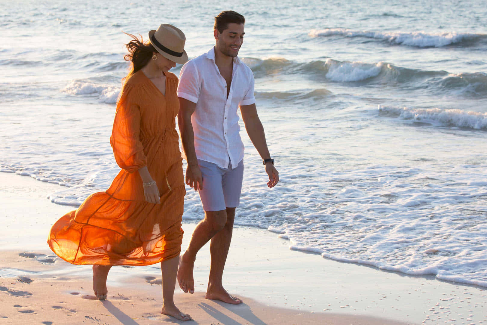 Couple At Beach Strolling Jumeirah Private Beach Background