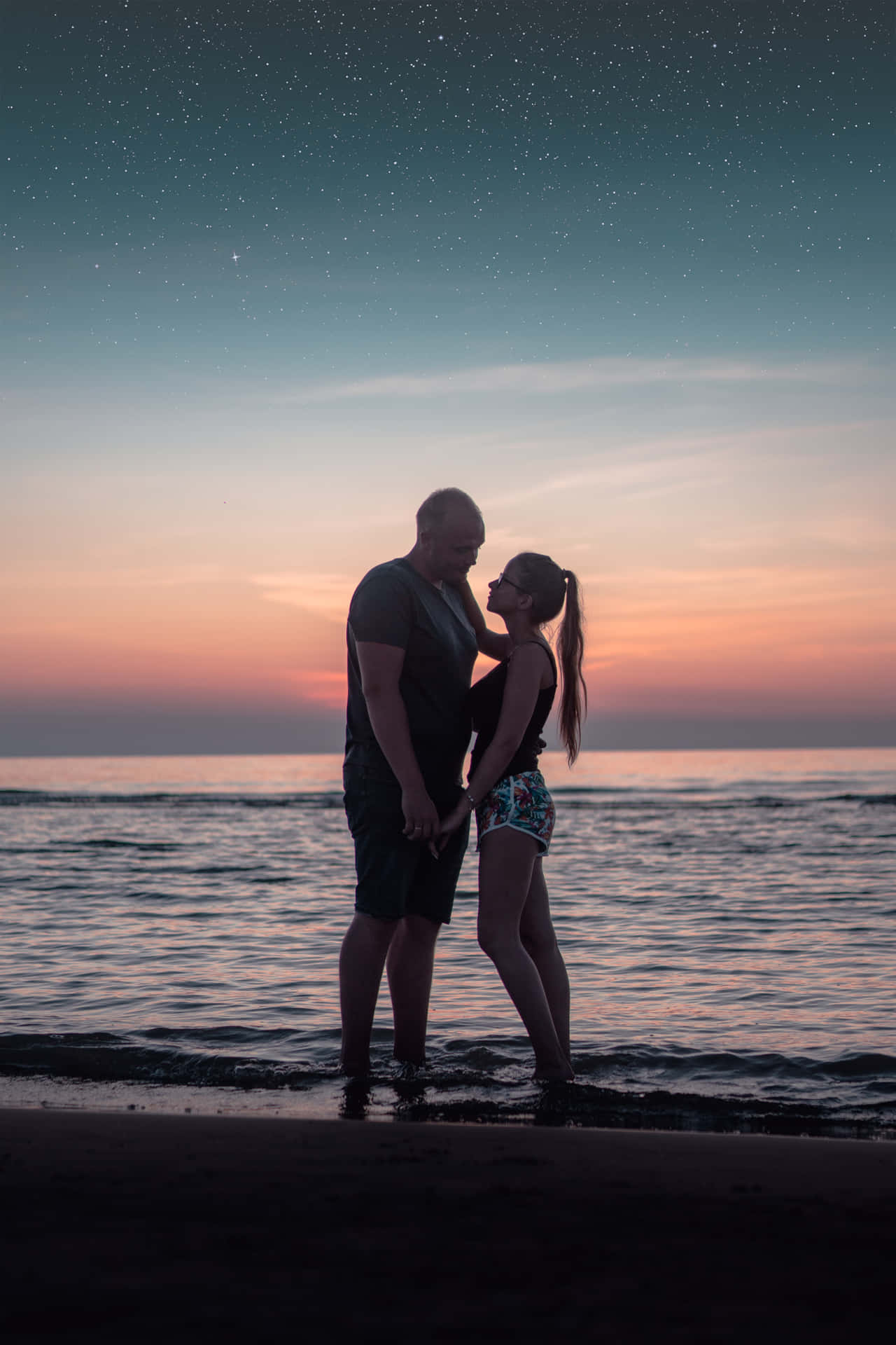 Couple At Beach Twilight Shot Background