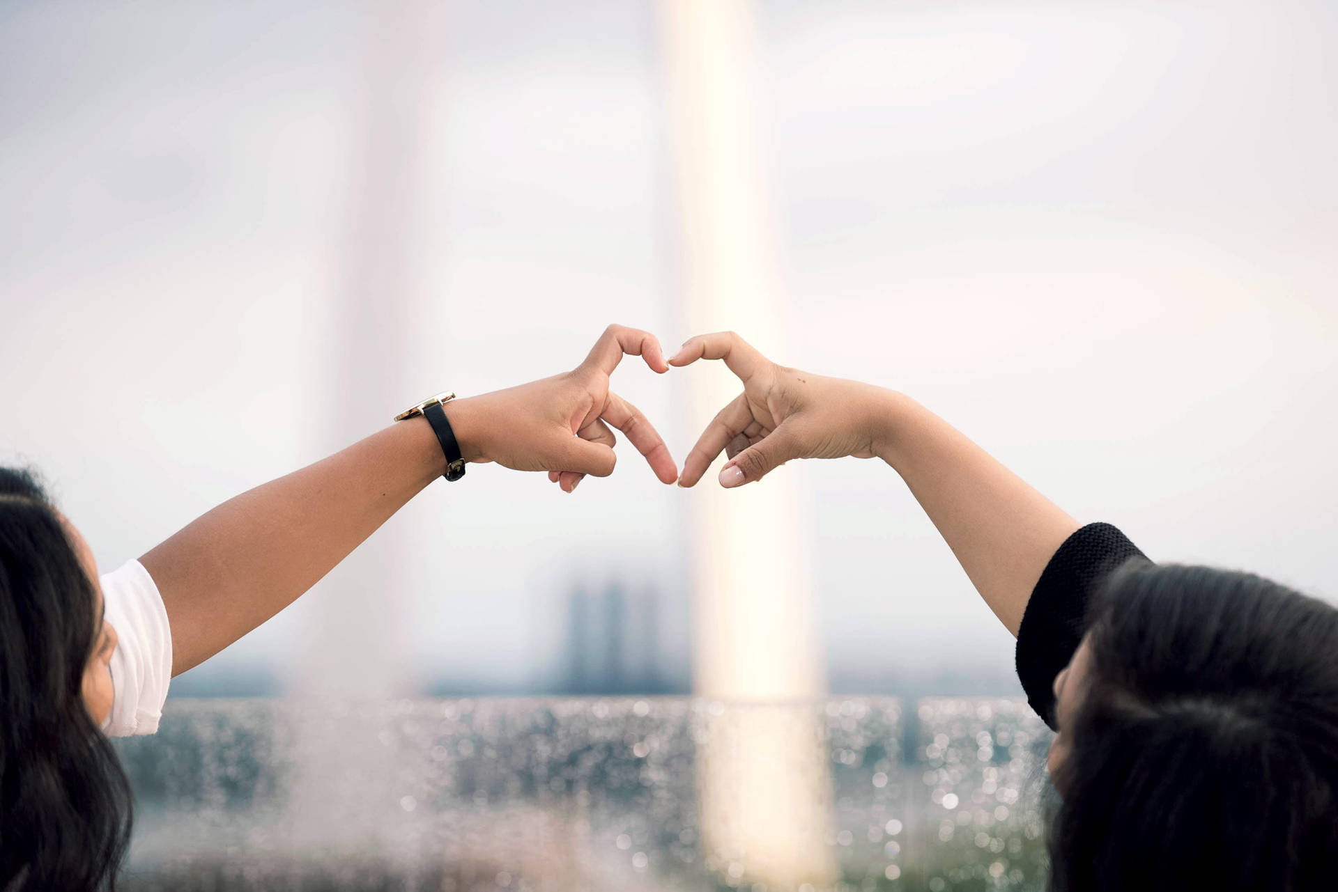 Couple Doing Finger Heart Trend Background