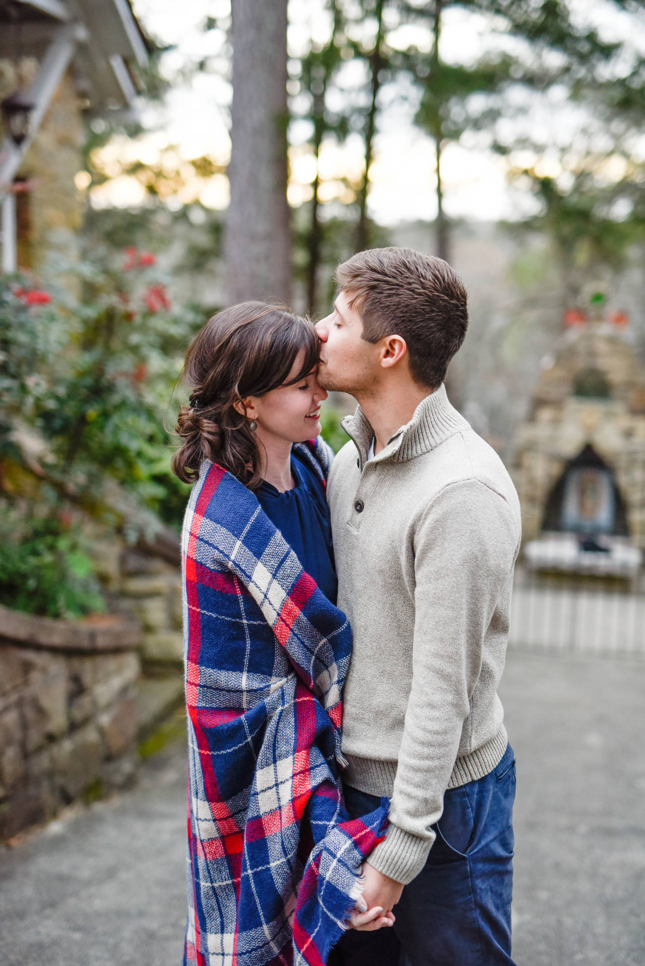 Couple Forehead Kiss In Garden Background