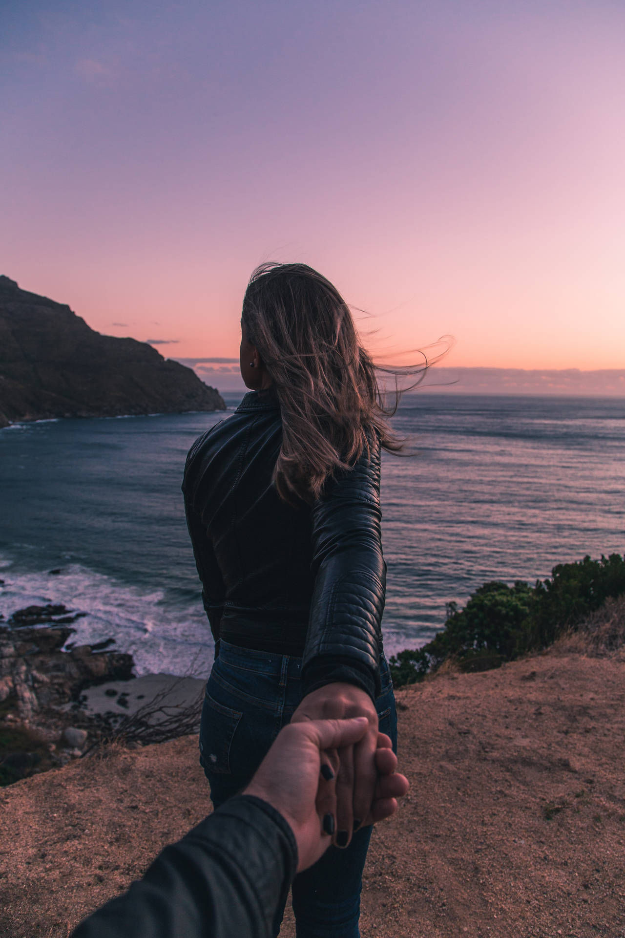 Couple Hands Ocean Cliffside Background