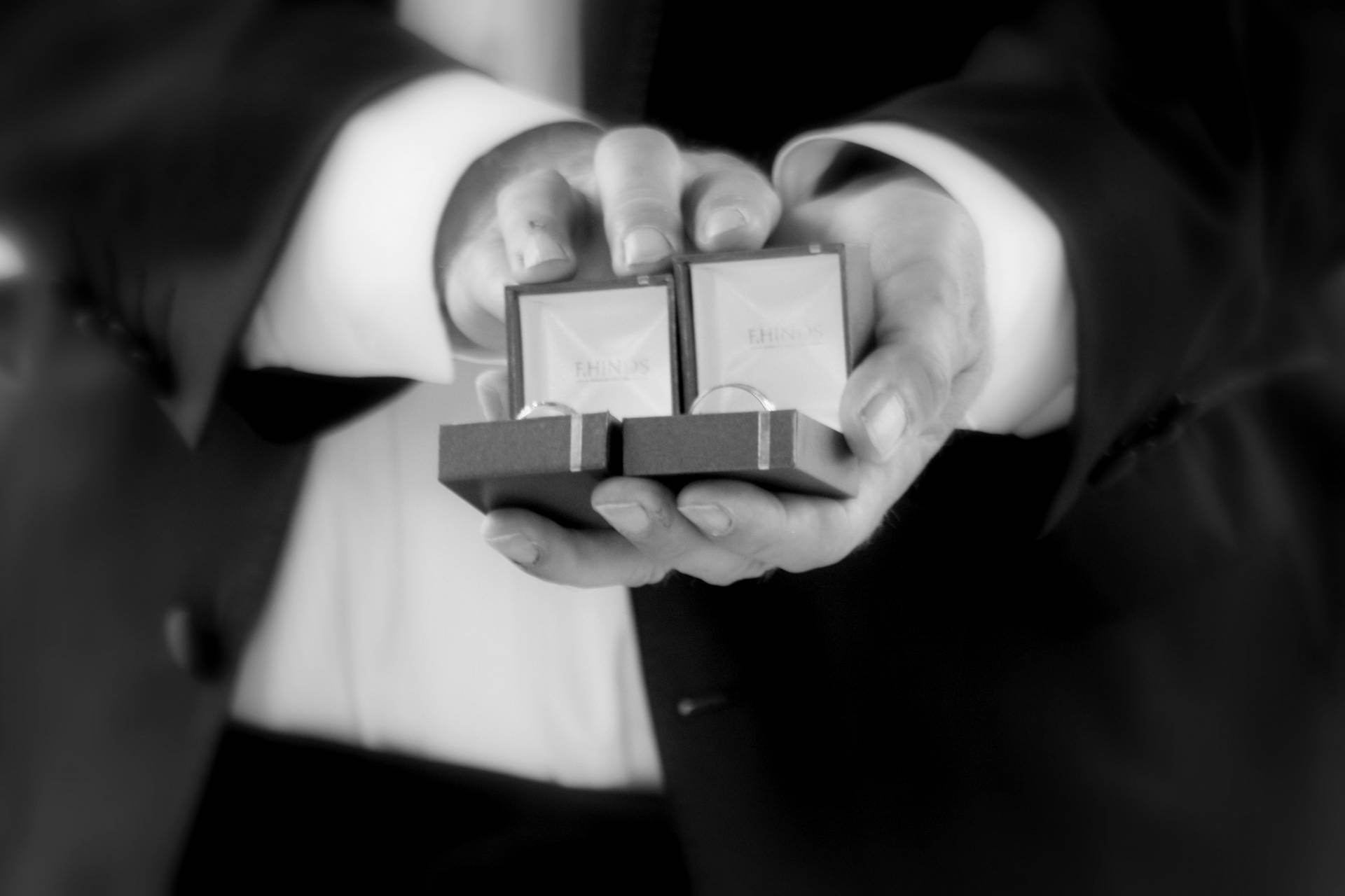 Couple Hands Wedding Ring Boxes Background