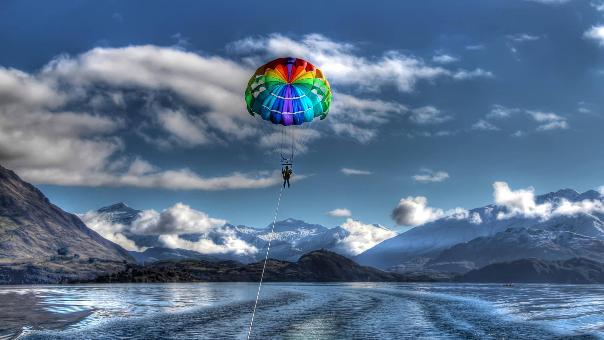 Couple Having Fun While Parasailing Background