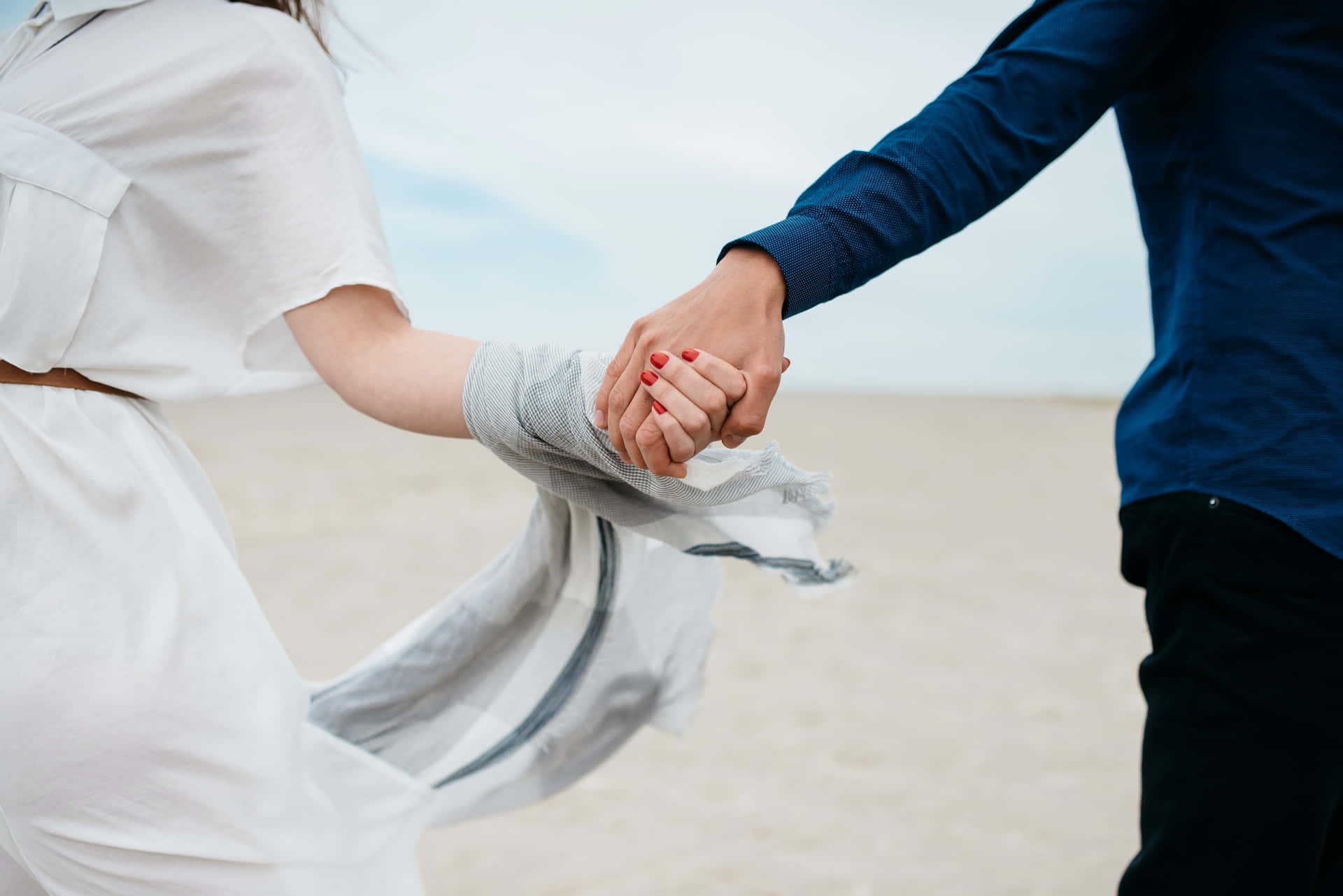 Couple Holding Hands Beach Walk Background
