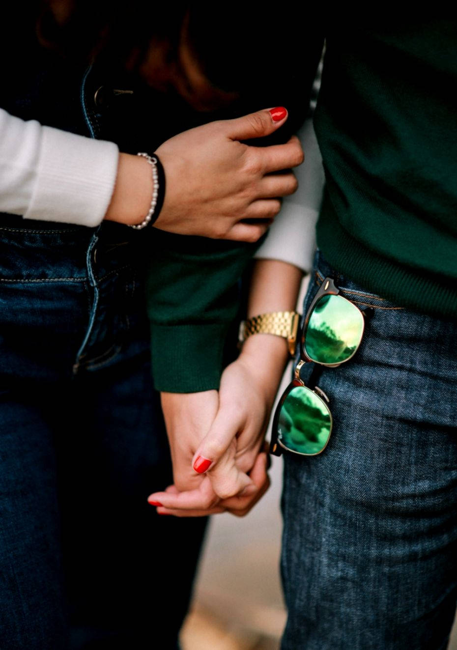 Couple Holding Hands With Sunglasses Background