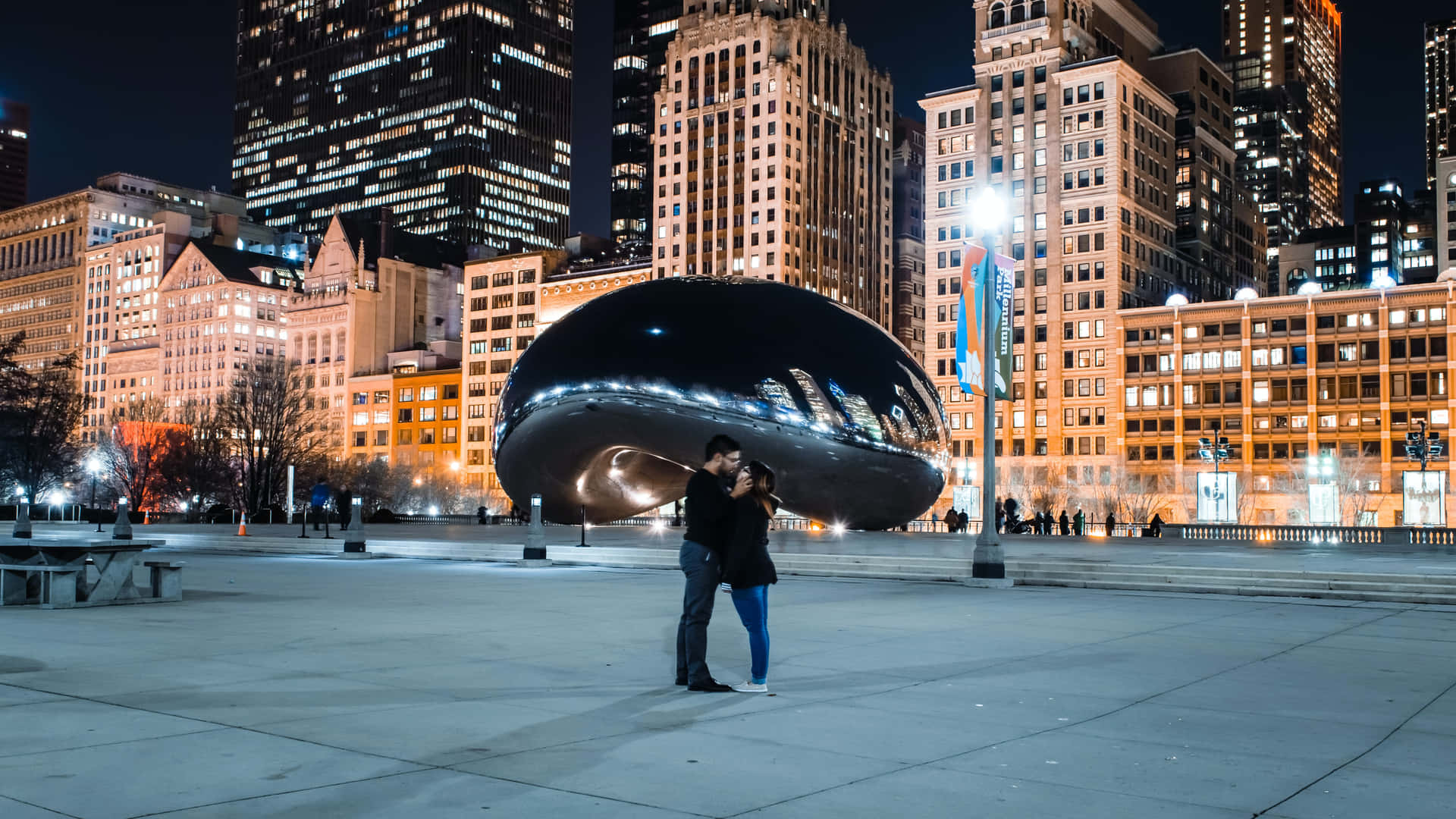 Couple Hug At Cloud Gate In Millennium Park Background