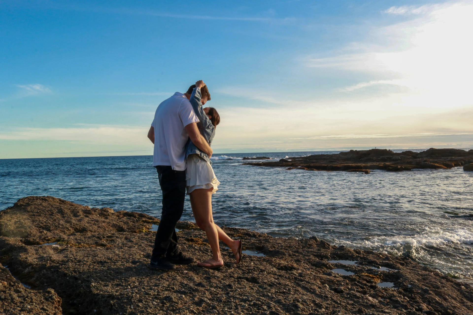 Couple Hugging At Treasure Island Laguna Beach California Background