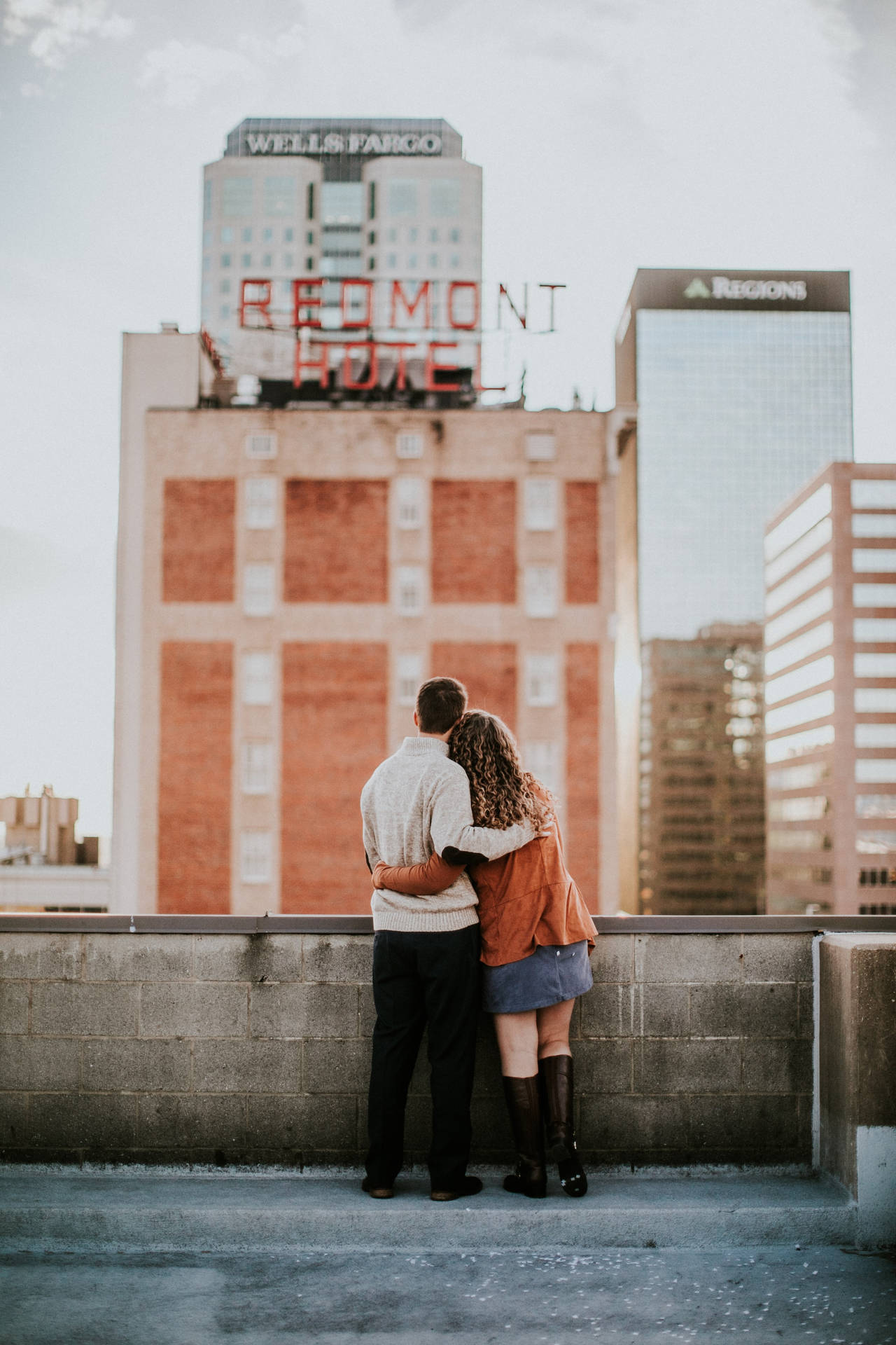 Couple Hugging Side By Side Downtown Birmingham Rooftop Background