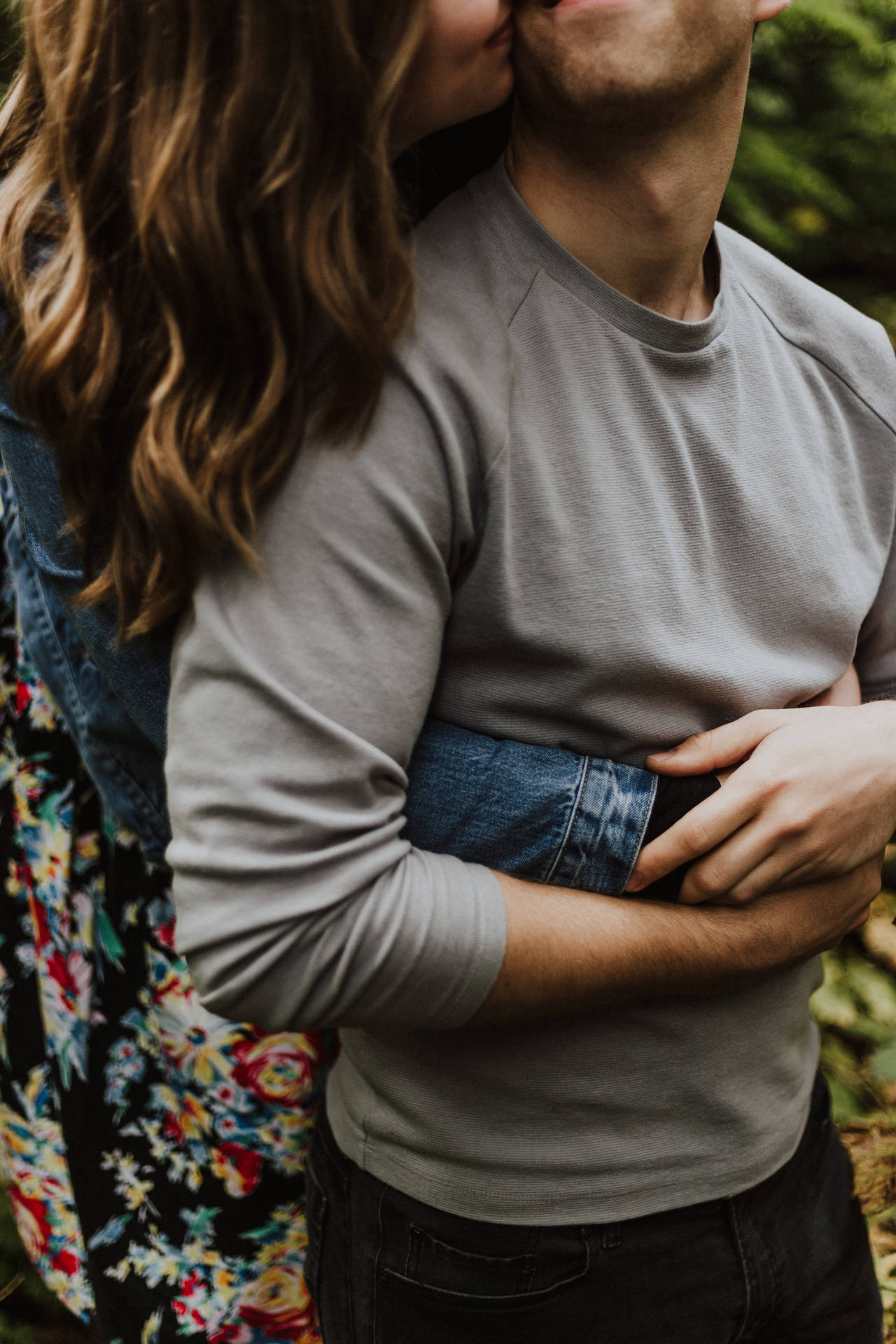 Couple Hugging With Kiss On The Cheek Background