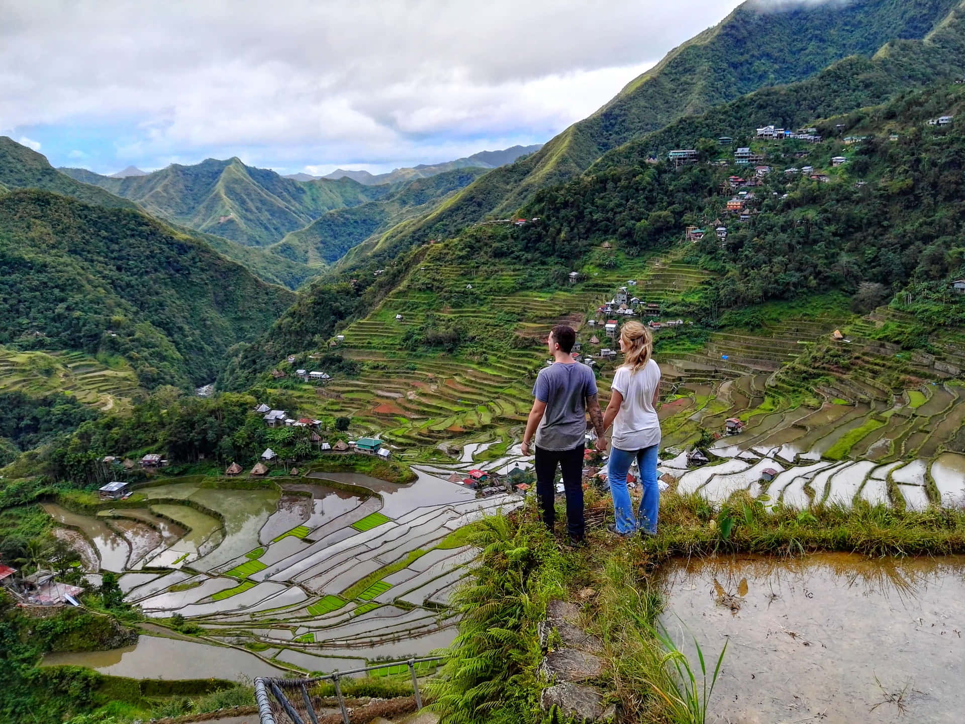 Couple In Banaue Rice Terraces In The Philippines Background