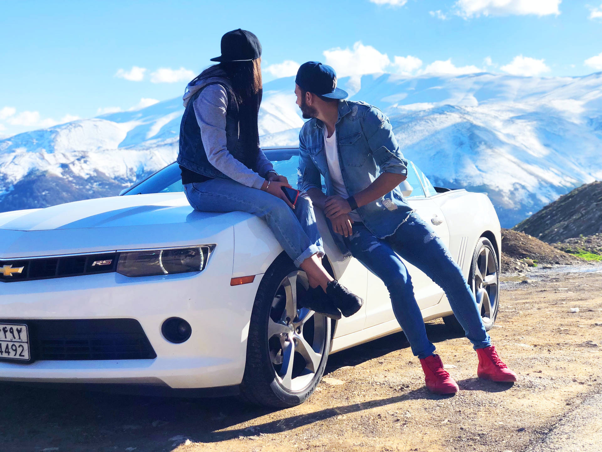 Couple In Love On A White Chevrolet Background