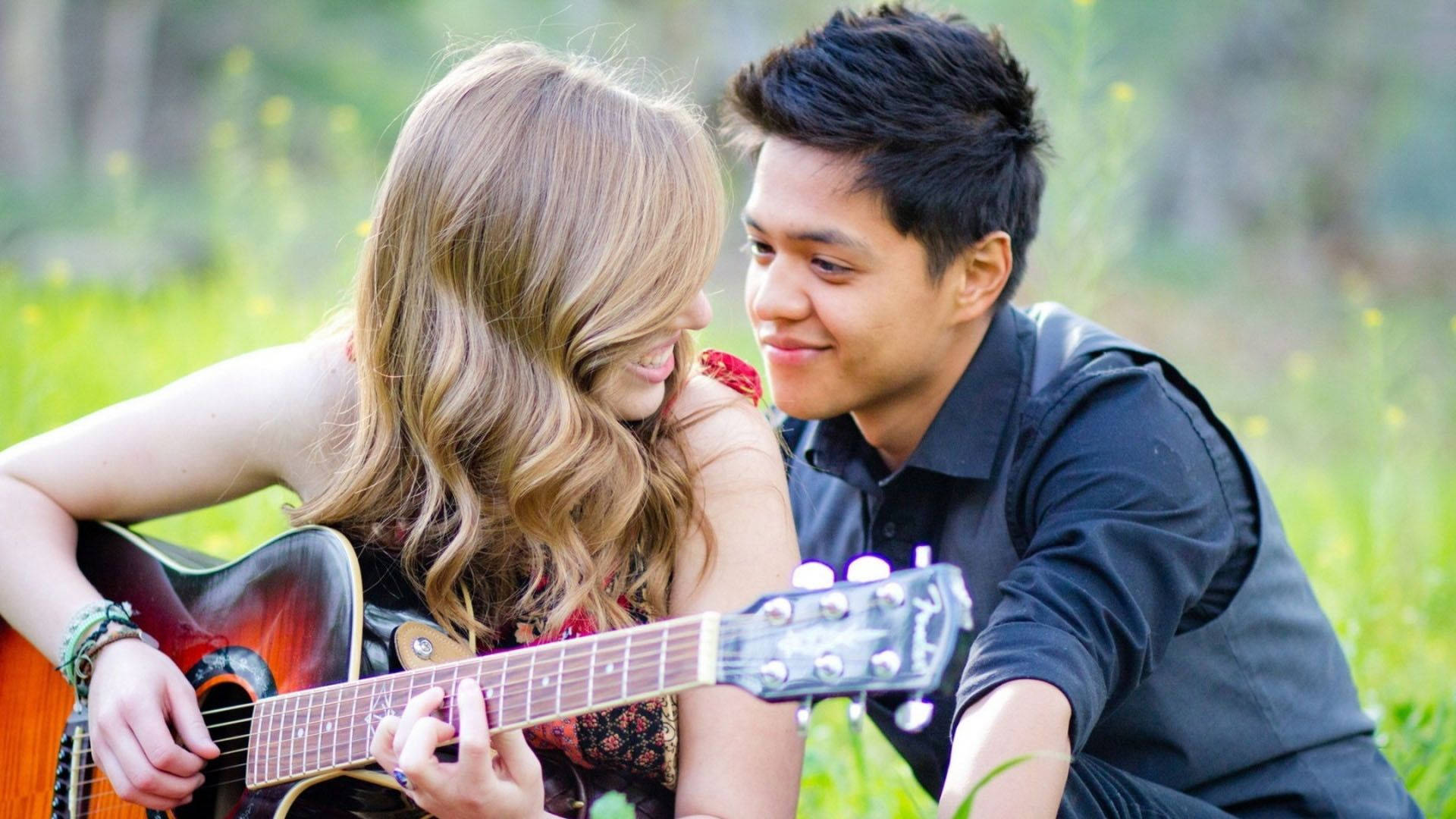 Couple Playing Guitar