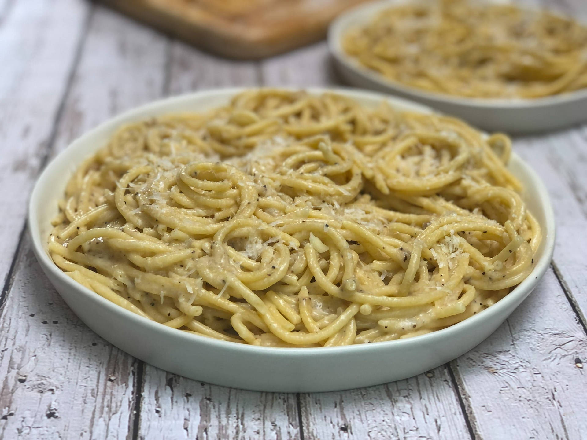 Couple Serving Of Cacio E Pepe Background