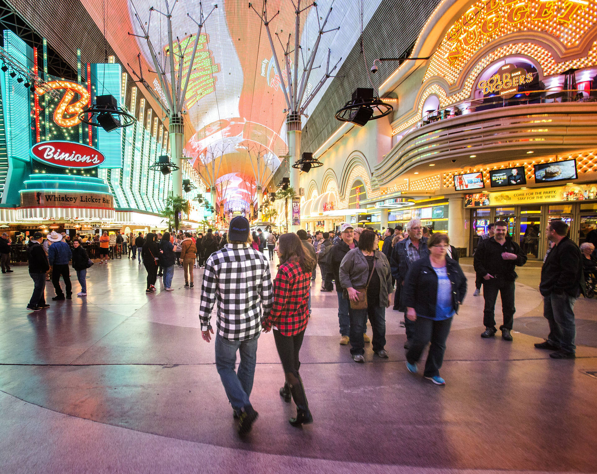 Couple Walking In Fremont Street