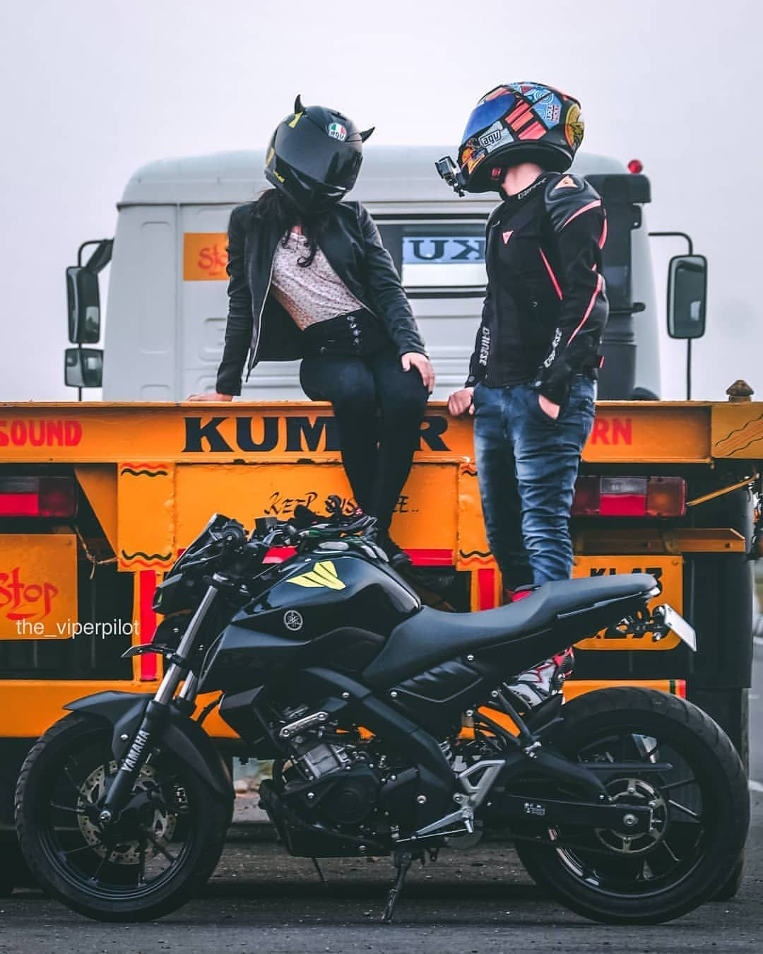 Couple With Black Yamaha Mt 15 Background