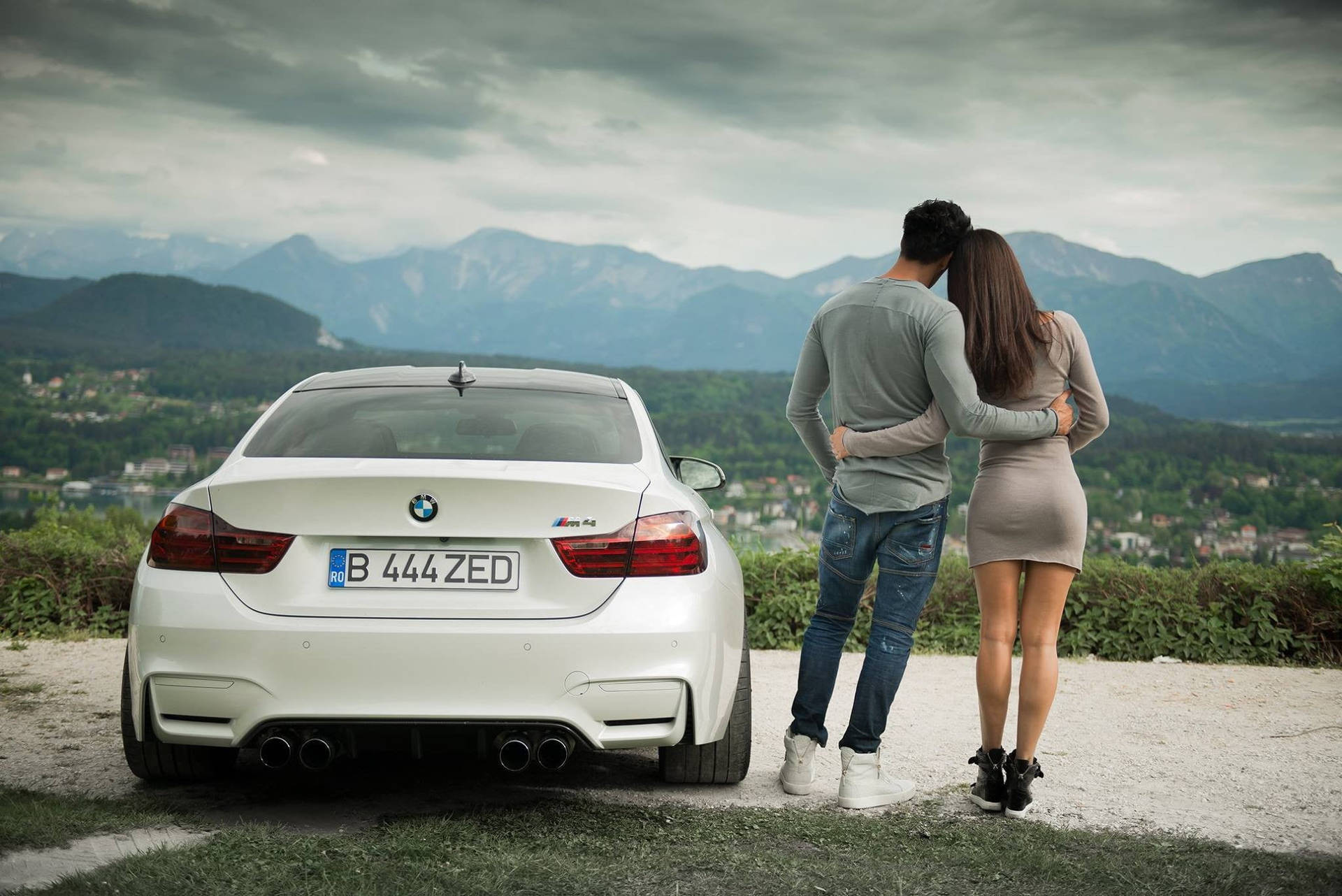 Couple With White Bmw M4 Background