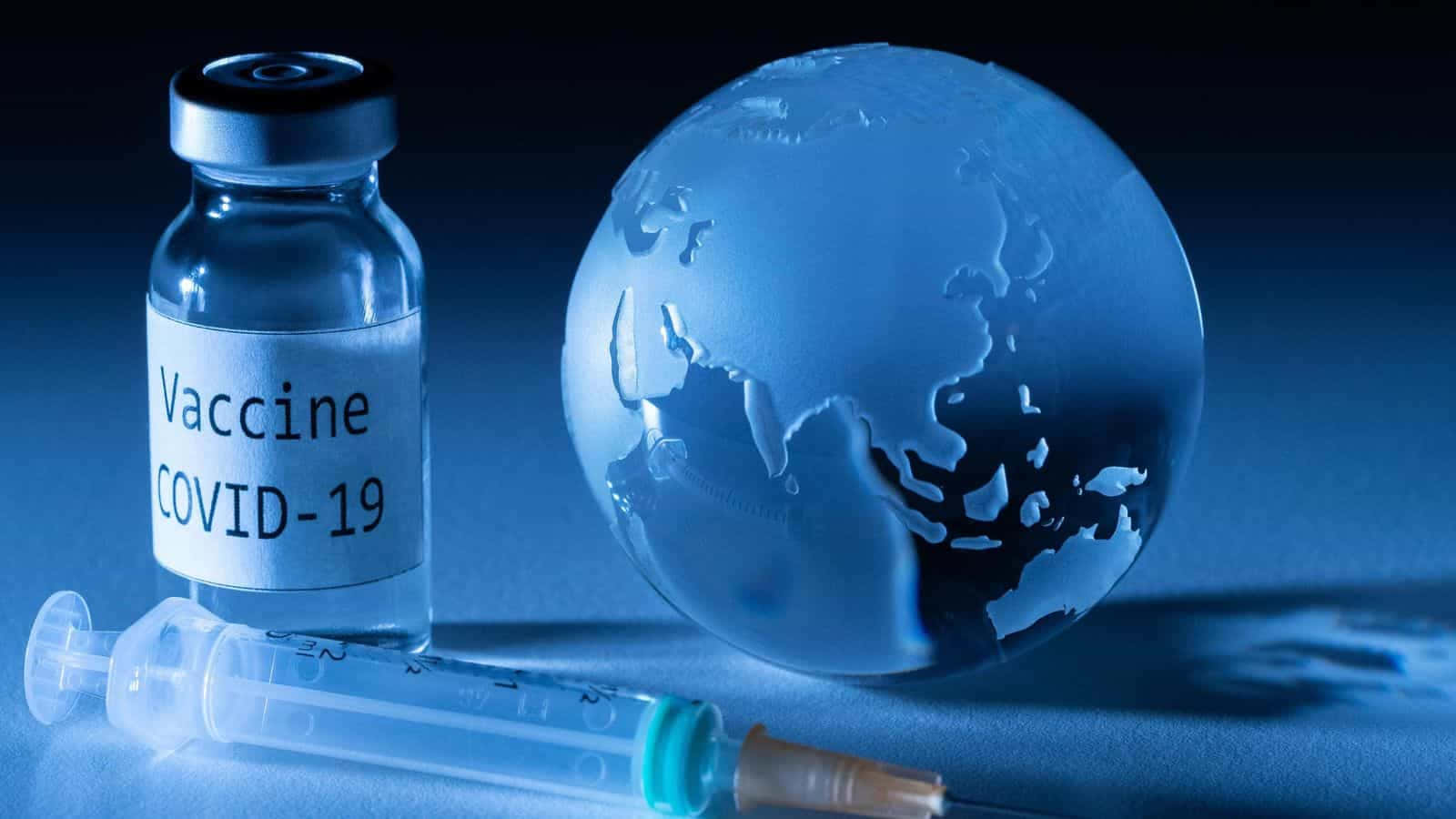 Covid-19 Vaccine Syringe And Earth Globe