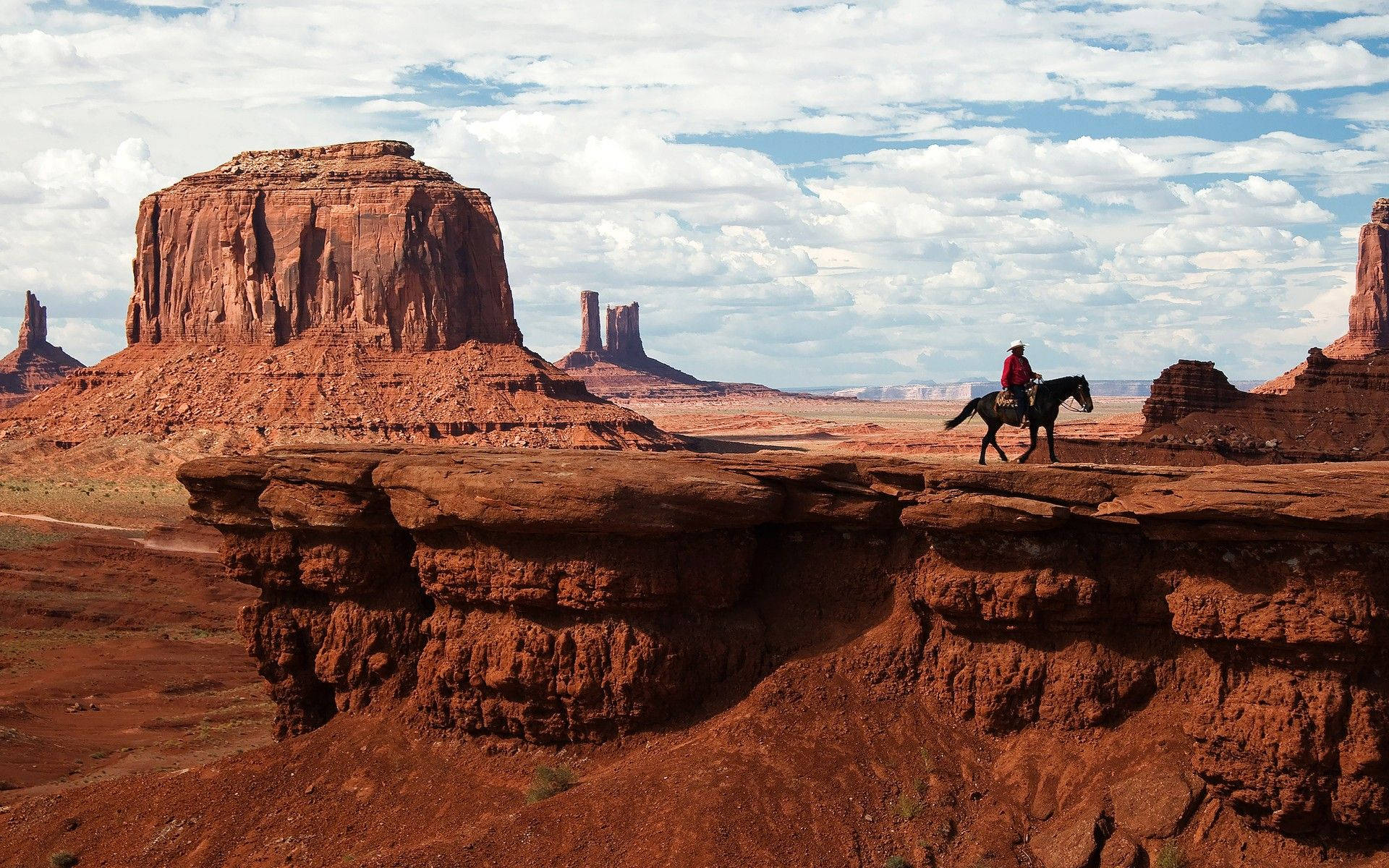 Cowboy At Monument Valley Background