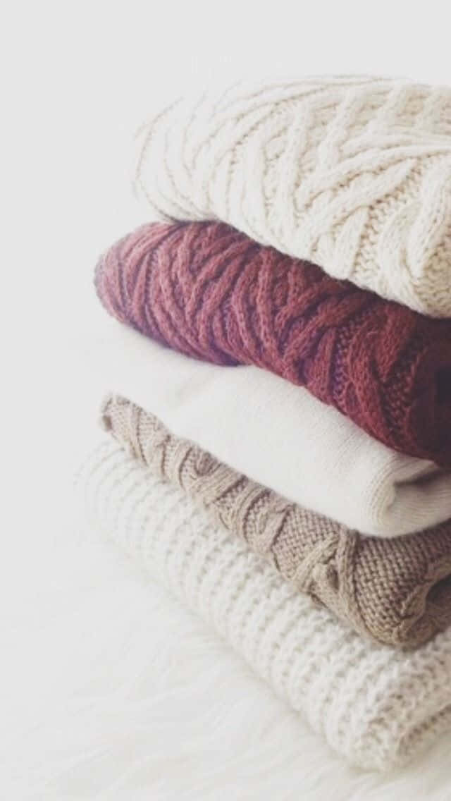 Cozy Minimalistic Sweater Arrangement Background
