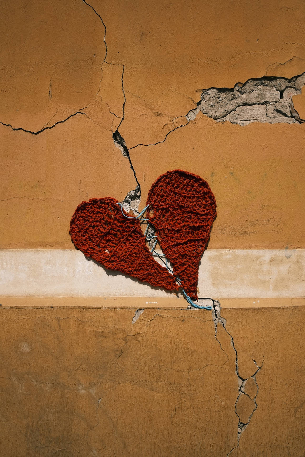 Cracked Heart On Brown Wall