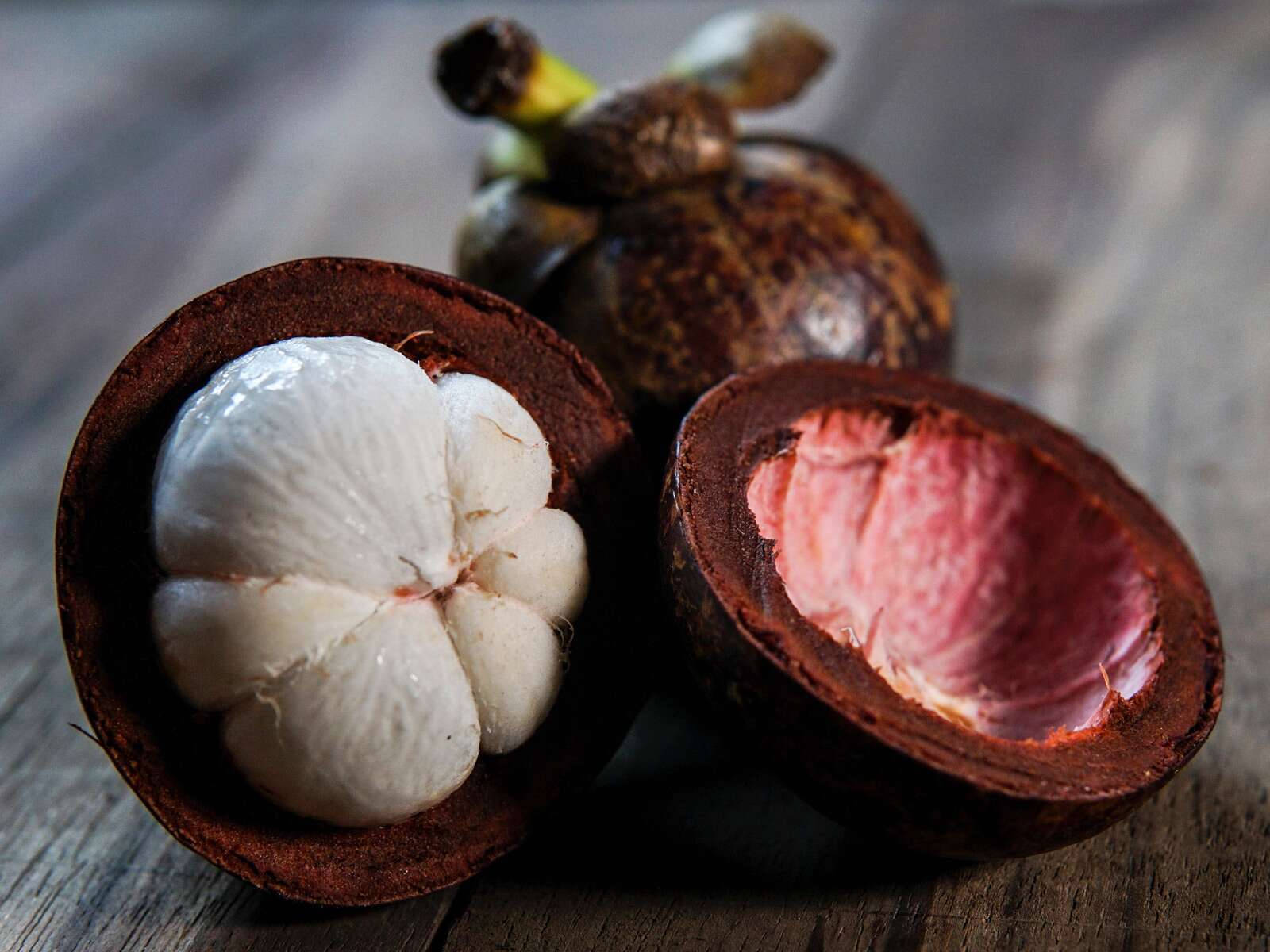 Cracked Open Mangosteen Tropical Fruit Background